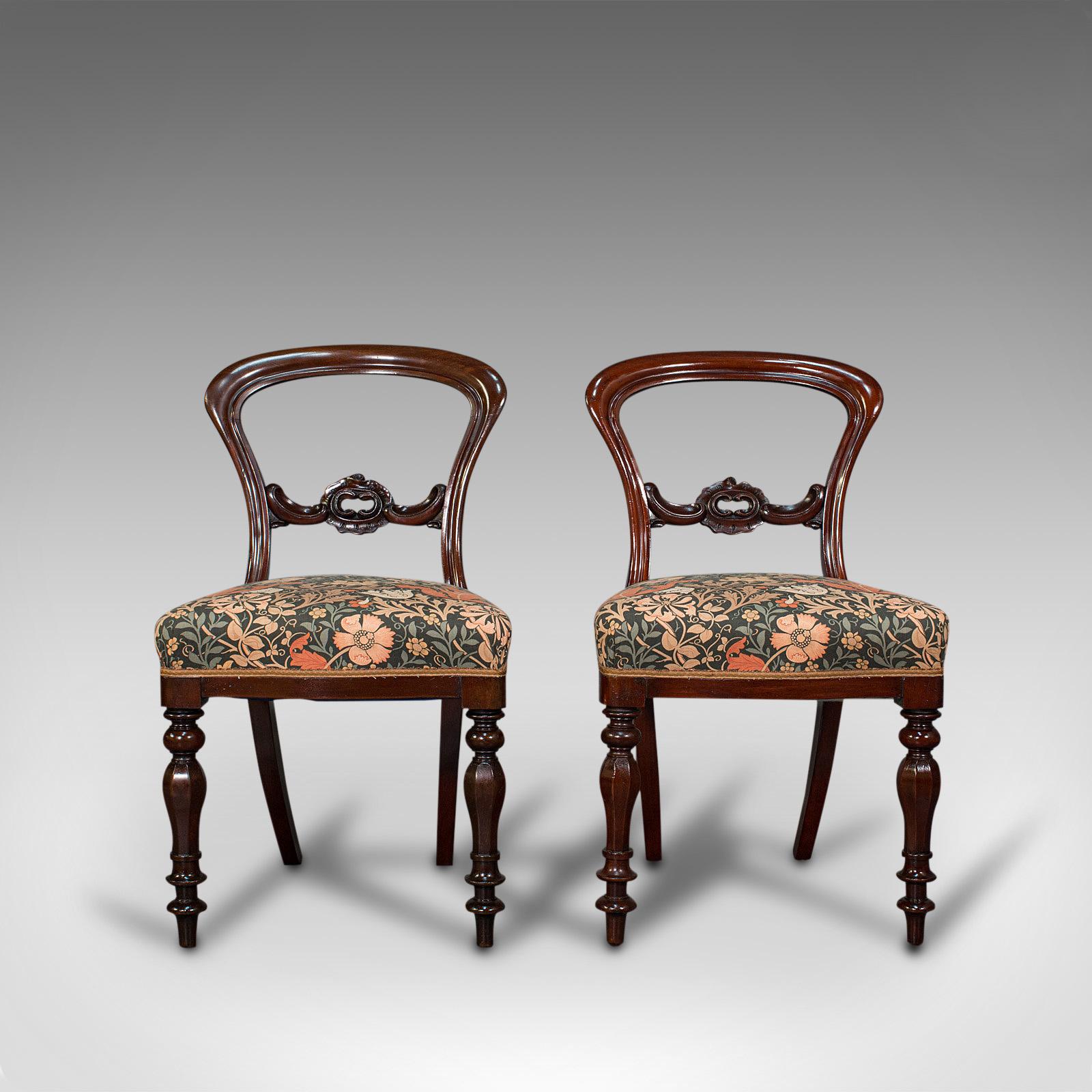 This is a pair of antique buckle back chairs. An English, walnut dining or side seat, dating to the early Victorian period, circa 1840.

Wonderful early Victorian craftsmanship
Displaying a desirable aged patina
Select walnut shows fine grain