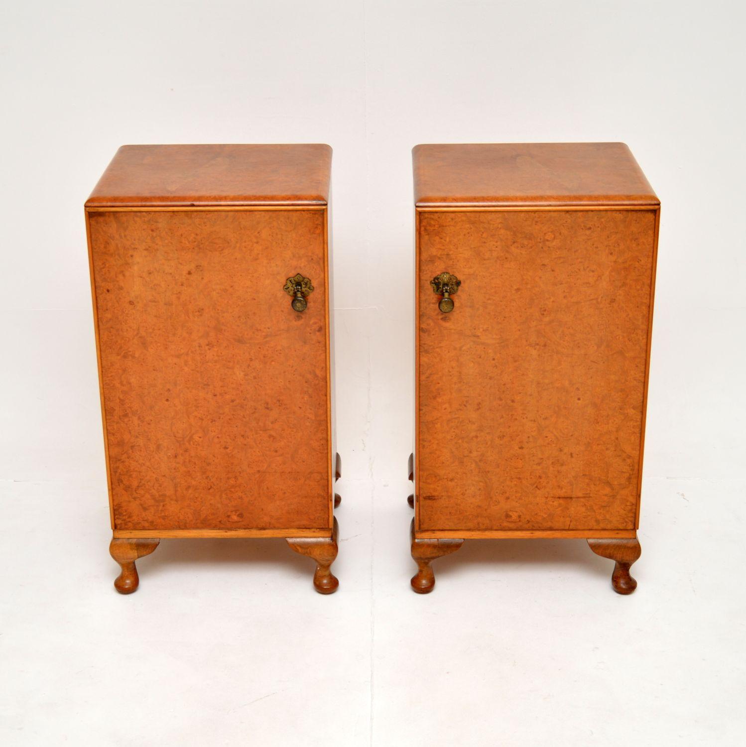 A stunning pair of antique burr walnut bedside cabinets. They were made in England, and date from the 1930’s.

They are beautifully made and are a very useful size. The door fronts and tops have gorgeous burr walnut grain patterns, they sit on