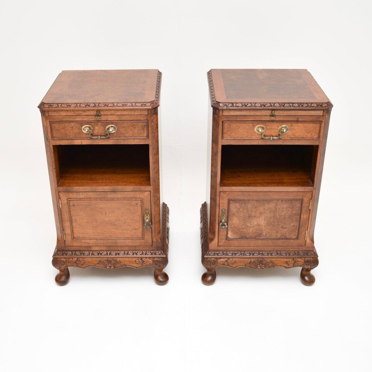 A fantastic pair of antique burr walnut bedside cabinets. They are in the Queen Anne style, they date from the 1920-30’s.

The quality is exceptional, they have stunning burr walnut grain patterns and crisp carving throughout. The tops are cross