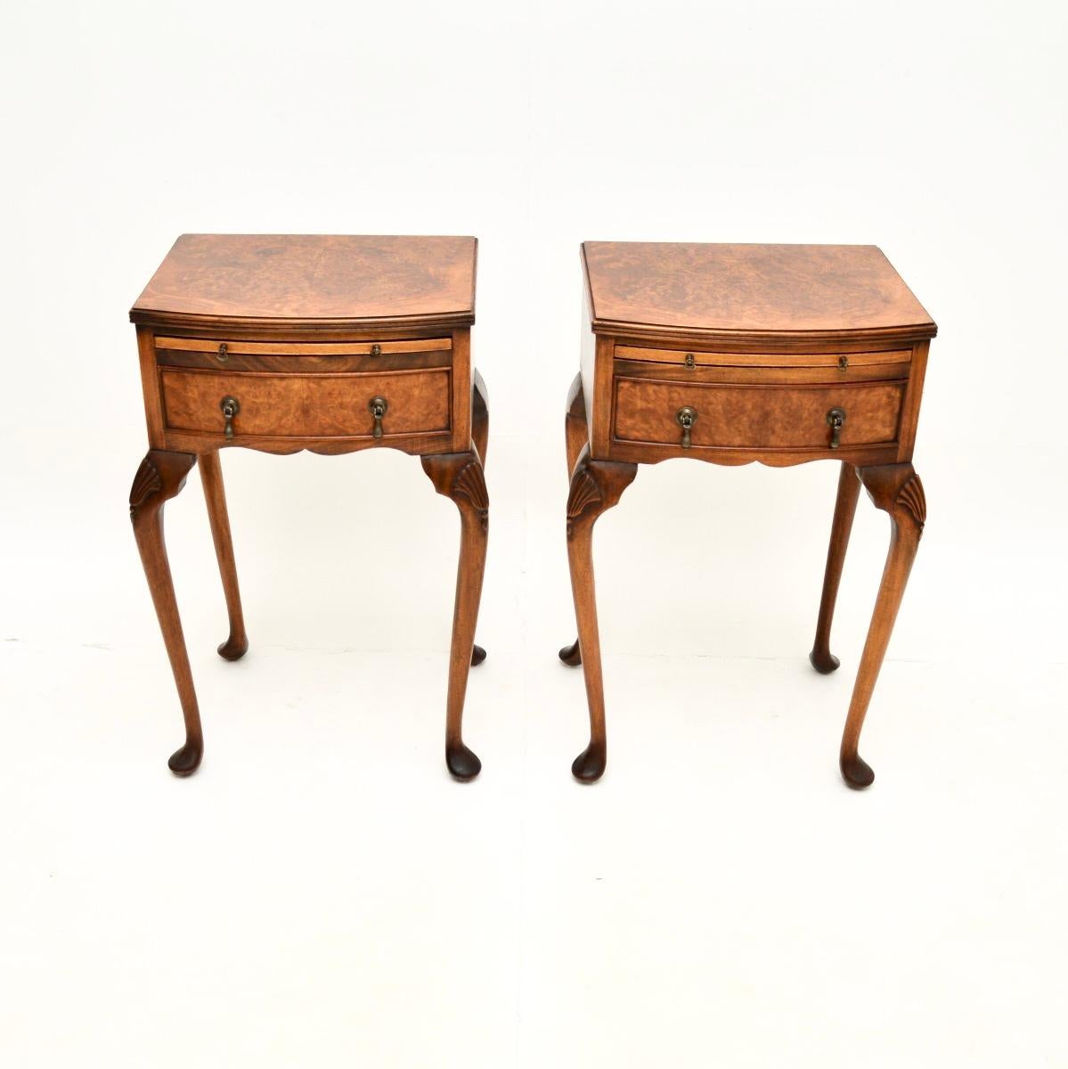 A beautiful and very impressive pair of antique burr walnut bedside tables. They are in the Queen Anne style, they were made in England and date from around the 1930’s.

The quality is lovely, they sit on elegant cabriole legs with shell carving at