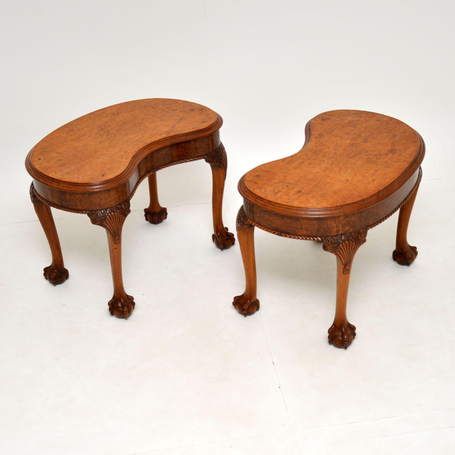 A stunning and very unusual pair of side tables in solid walnut, with beautiful burr walnut veneered tops. These date from the 1900-1920’s period.

They are of amazing quality and are a very useful size. They have fine, deep carvings around the