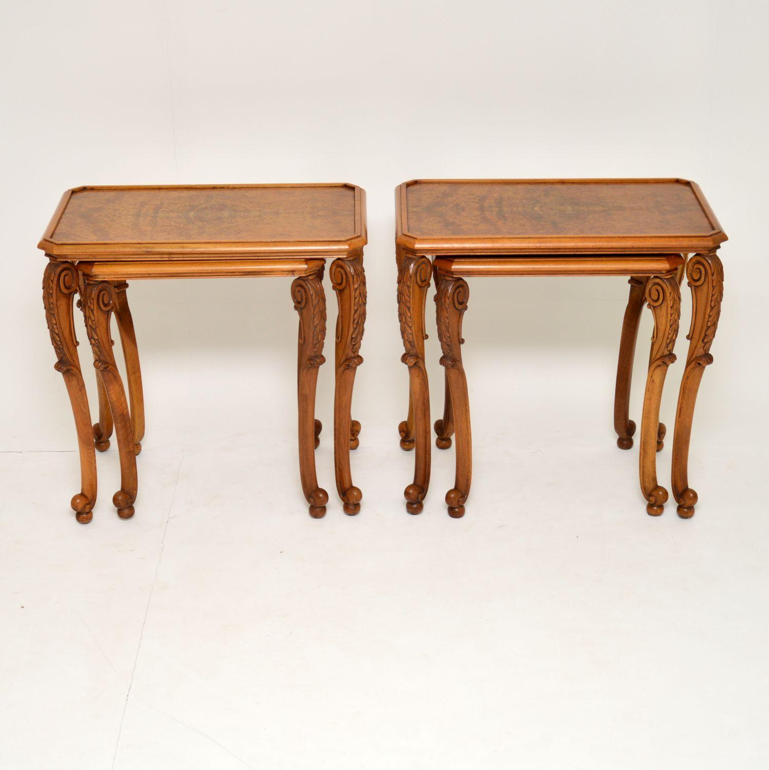 Unusual pair of antique walnut nests of two tables dating from the 1920s period, in excellent condition, having just been French polished. These tables would work well either side of a sofa as side tables and are very practicable having the extra