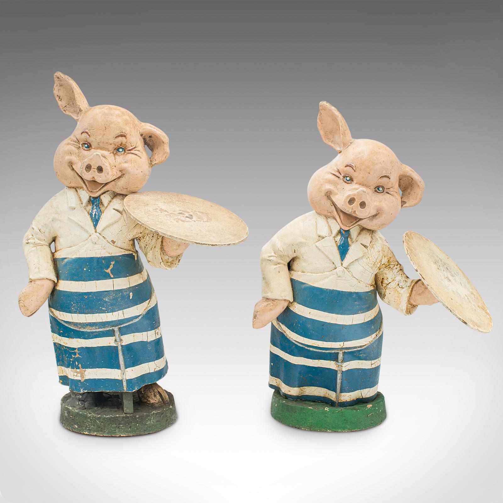 This is a pair of antique decorative butchery pigs. An English, plaster shop display figure, dating to the Edwardian period, circa 1910.

Rare and unusual pair of display pigs in appealingly original order
Displaying a desirable aged patina