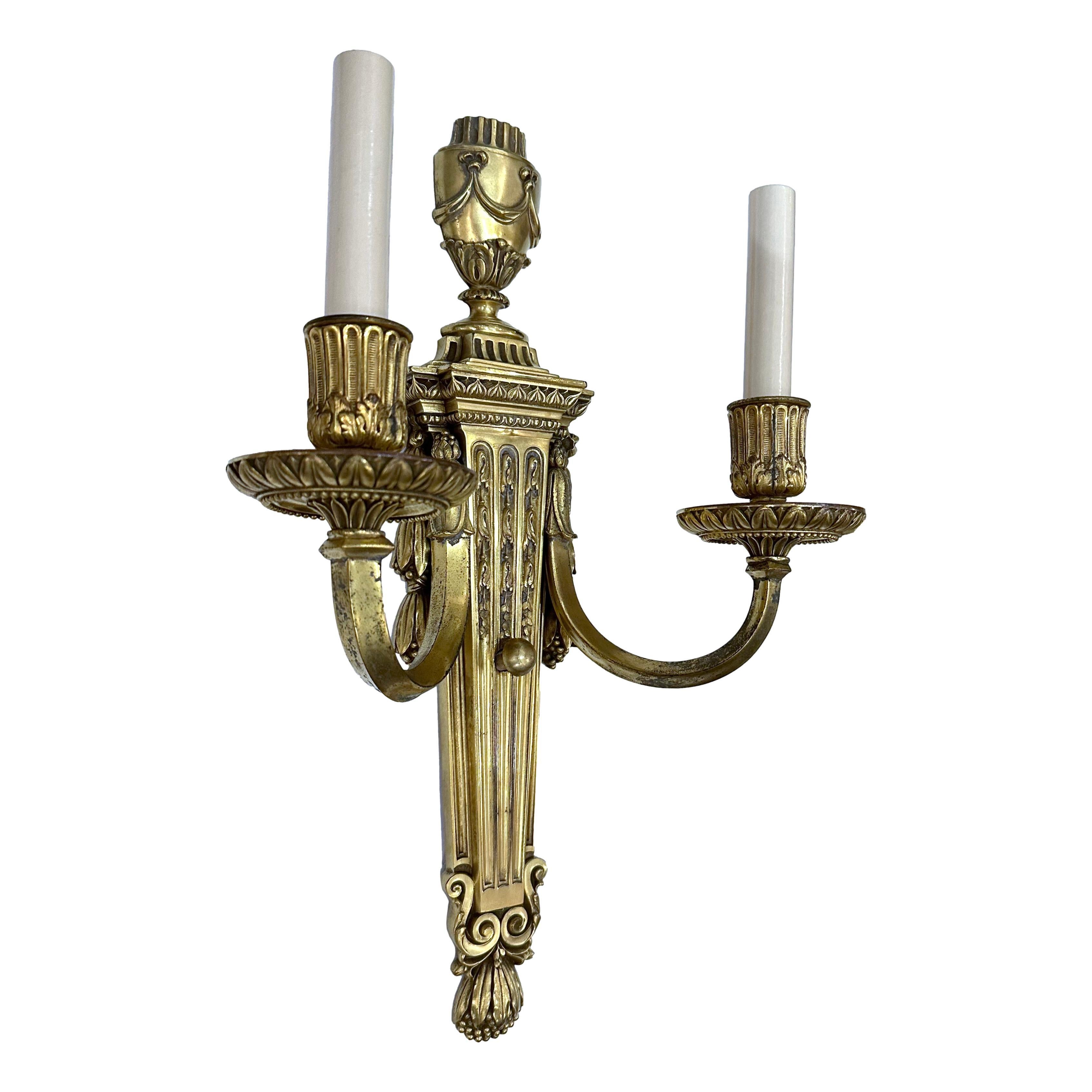 Pair of circa 1920's American gilt neoclassic style sconces by Caldwell.

Measurements:
Height: 18.25