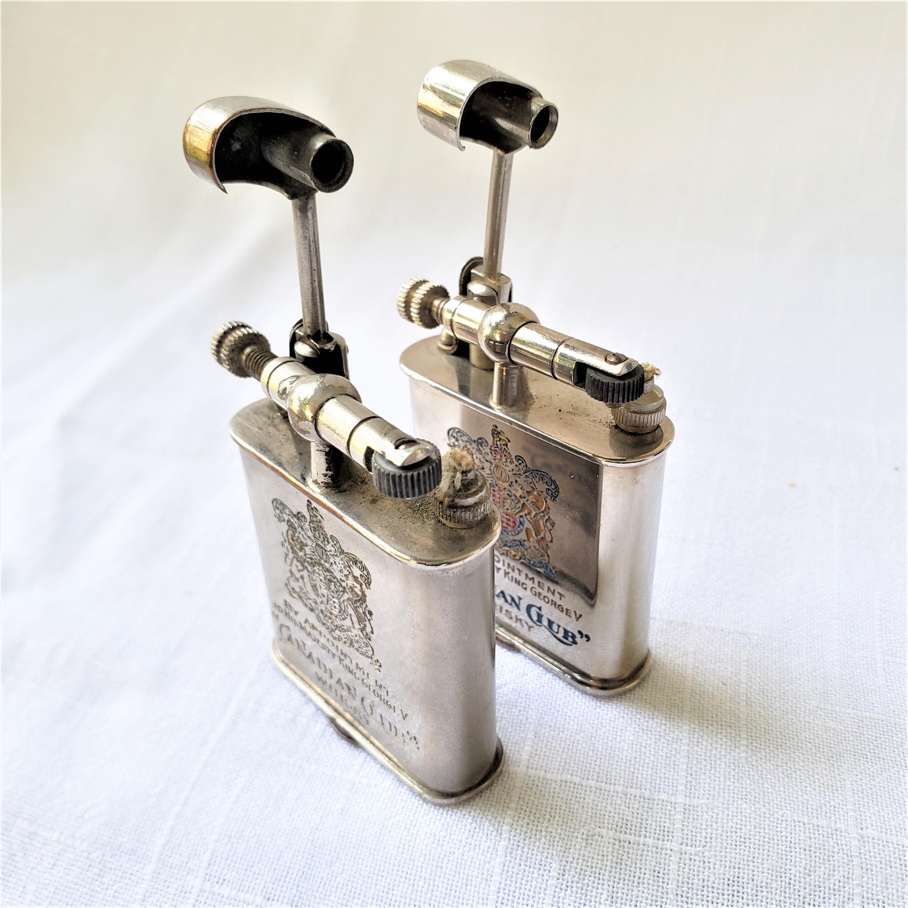 Metal Pair of Antique Canadian Club Whiskey Advertising Swing Arm Pocket Lighters For Sale