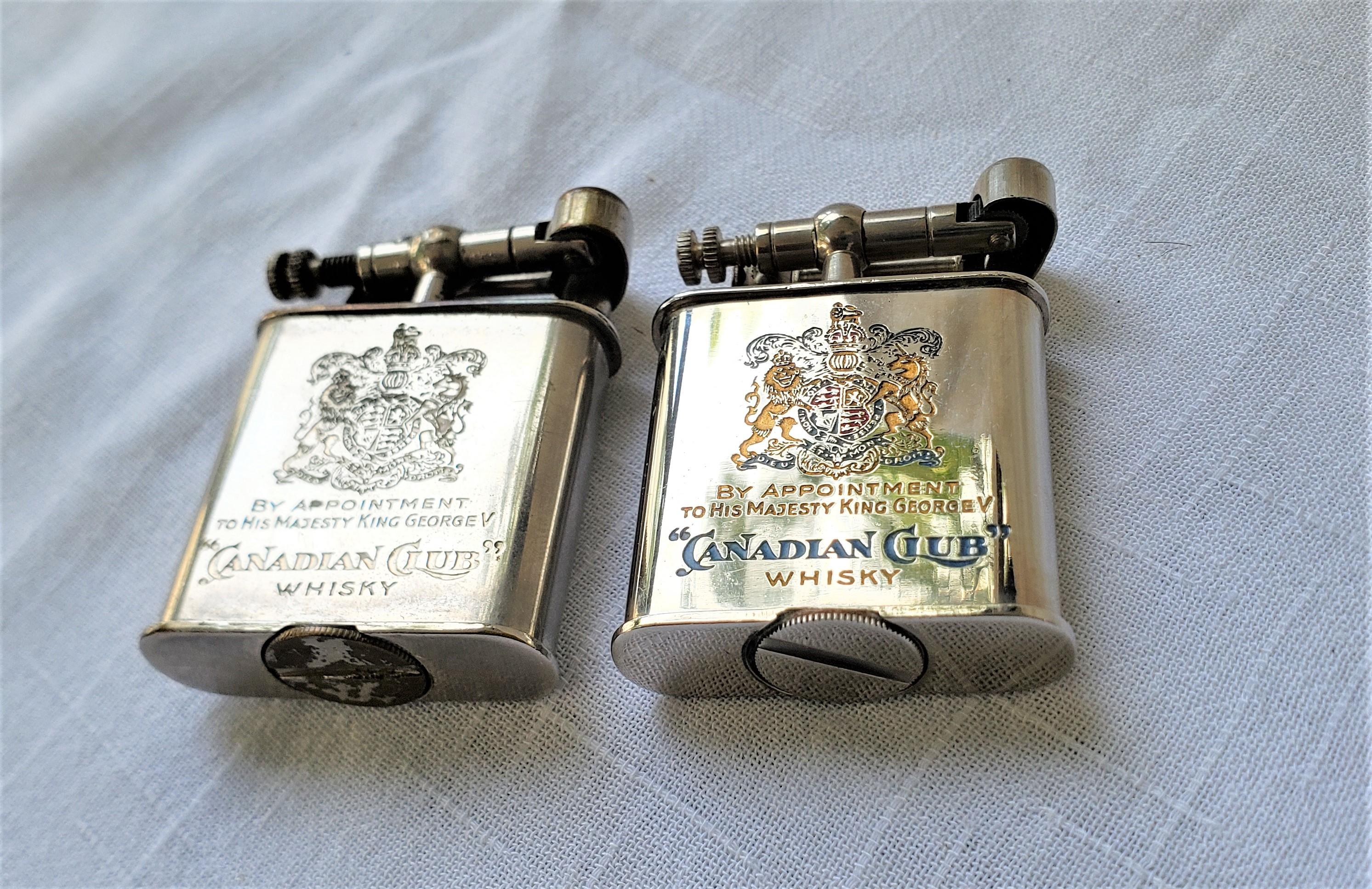 This pair of antique pocket lighters show no maker's signature, but originated from Germany and date to approximately 1920 and done in the period Art Deco style. The lighters are done with a chromed metal and have an egraved and cold-painted logo