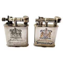 Pair of Used Canadian Club Whiskey Advertising Swing Arm Pocket Lighters