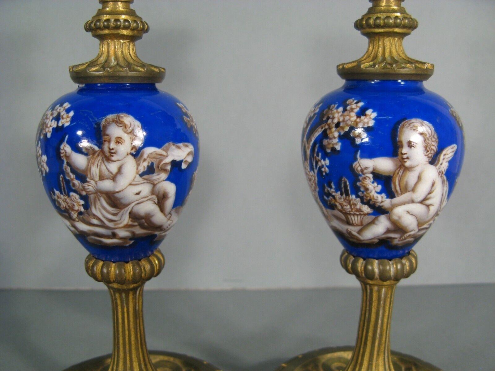 Bronze Pair of Antique Candlesticks in Romantic Style with Putti Decor - 1Y161