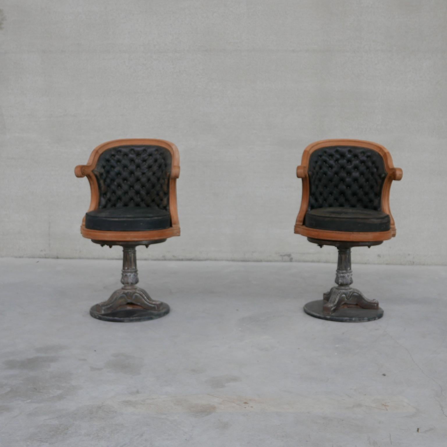 Metal and oak 'Officer's' or 'Captain's' chairs. 

France, early 20th century. 

Sat on heavy cast metal base. 

The chairs swivel. 

Some wear commensurate with age but generally good condition.

Price is per chair. Priced and sold