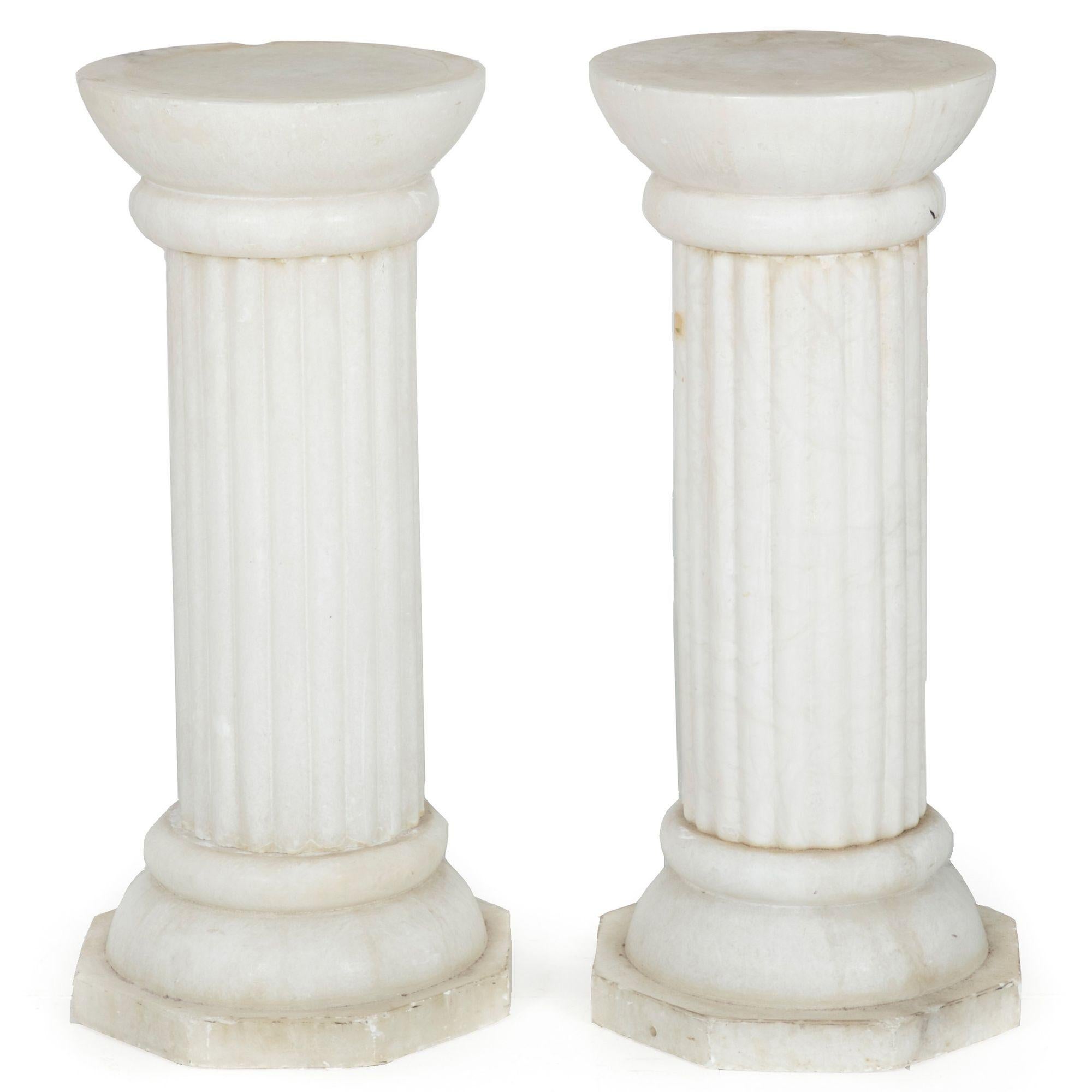 A very nice pair of aged marble pedestals of an attractively restrained size, they are just over 26