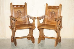 Pair of Antique Carved English Oak Armchairs with Armorial Crest Coat of Arms