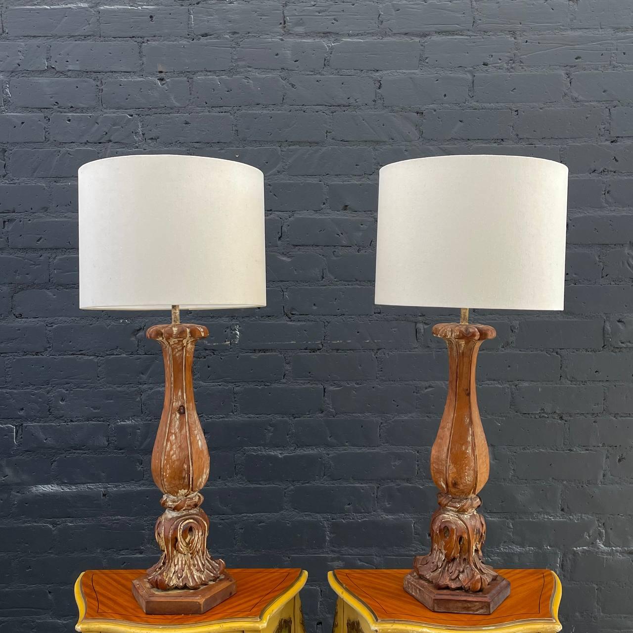 Pair of Antique Carved Italian Table Lamps with a Distressed Paint Finish 

Country: Italy
Materials: Distressed Wood
Style: Italian Antique 
Year: 1940s

$2,495 pair 

Dimensions:
35.50”H x 8”W x 8”D
Shades:
10”H x 15”W x 15”D.