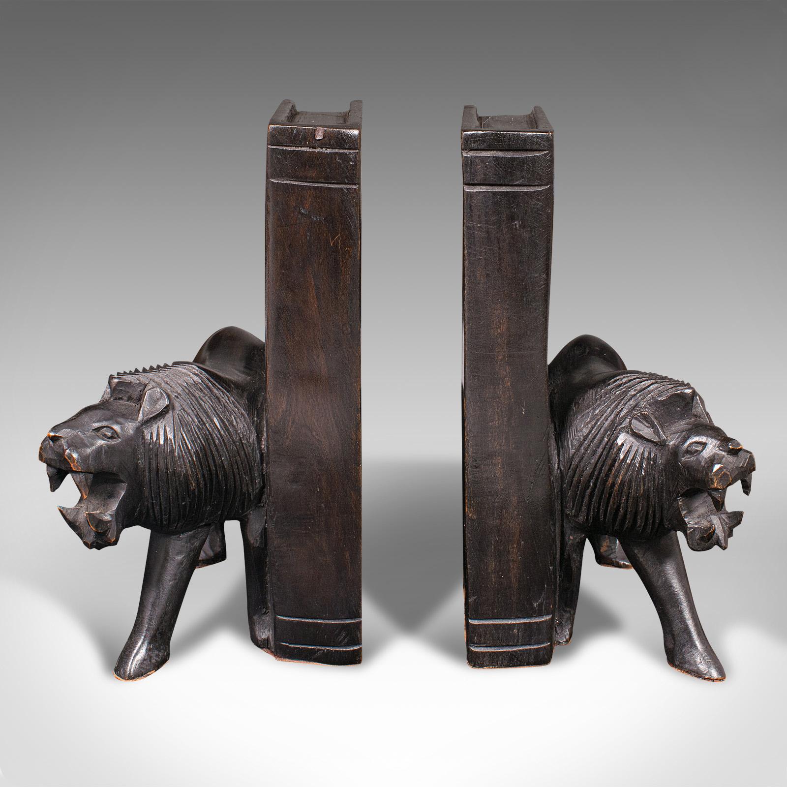 Our Stock # 18.9940

This is a pair of antique carved lion bookends. An Oriental, ebonised ironwood book rest with animal figure interest, dating to the late Victorian period, circa 1900.

Ferocious lion forms, with a charming decorative