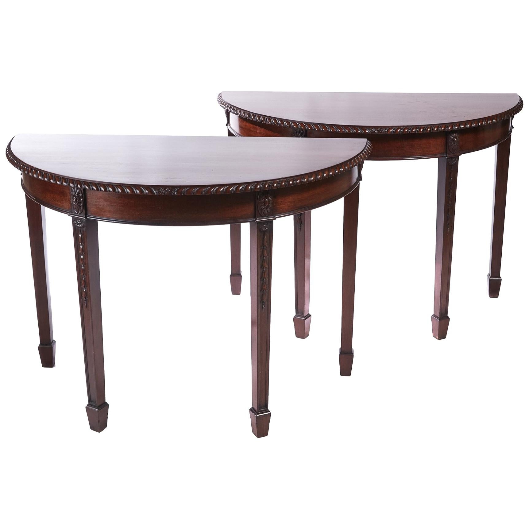 Pair of Antique Carved Mahogany Demilune Console Tables For Sale