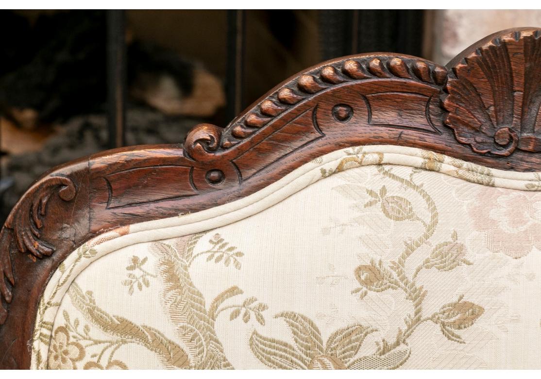 Fabric Pair Of Antique Carved Oak Louis XV Style Fauteuil For Sale