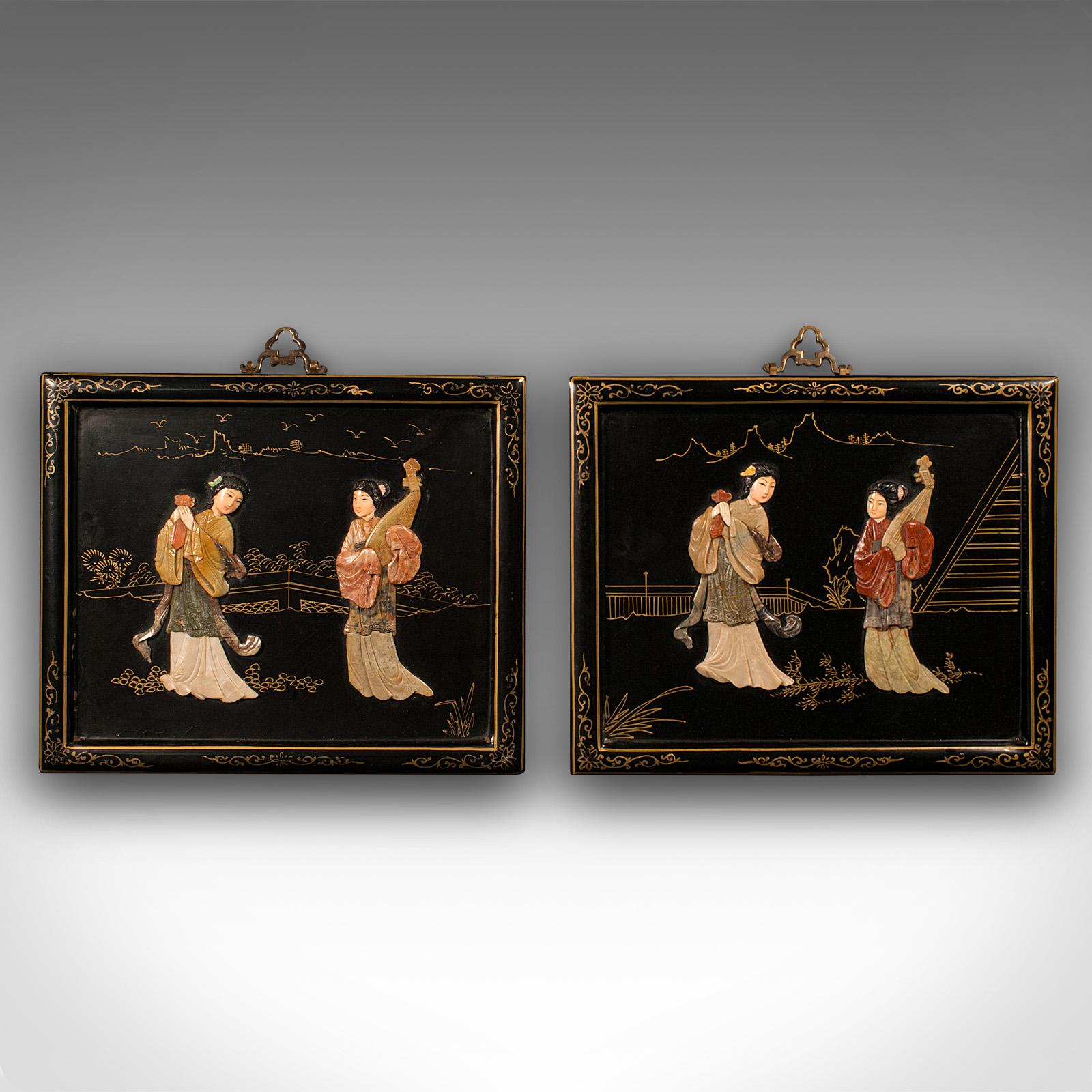 This is a pair of antique carved stone panels. A Japanese, lacquered decorative scene with female figures, dating to the late Victorian period, circa 1900.

Appealing Japanned decor with distinctive finish
Displays a desirable aged patina