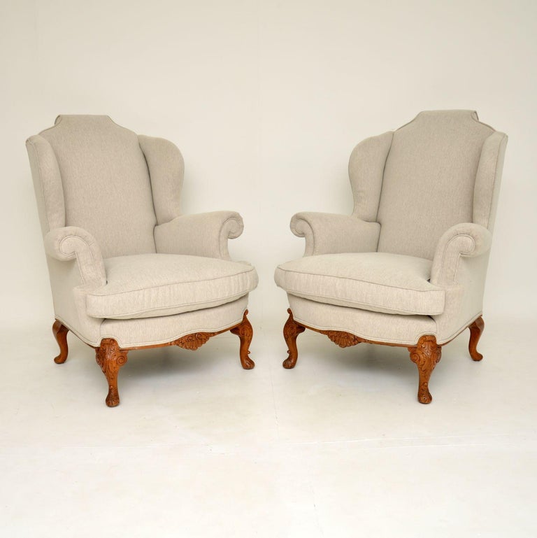 A magnificent pair of antique wing back armchairs in the Queen Anne style. These were made in England, they date from around the 1920-1930’s period.

The quality is outstanding and these are extremely comfortable to relax in. They are very large