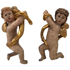 Pair of Antique Carved Wood and Gilded Cherub Sculptures