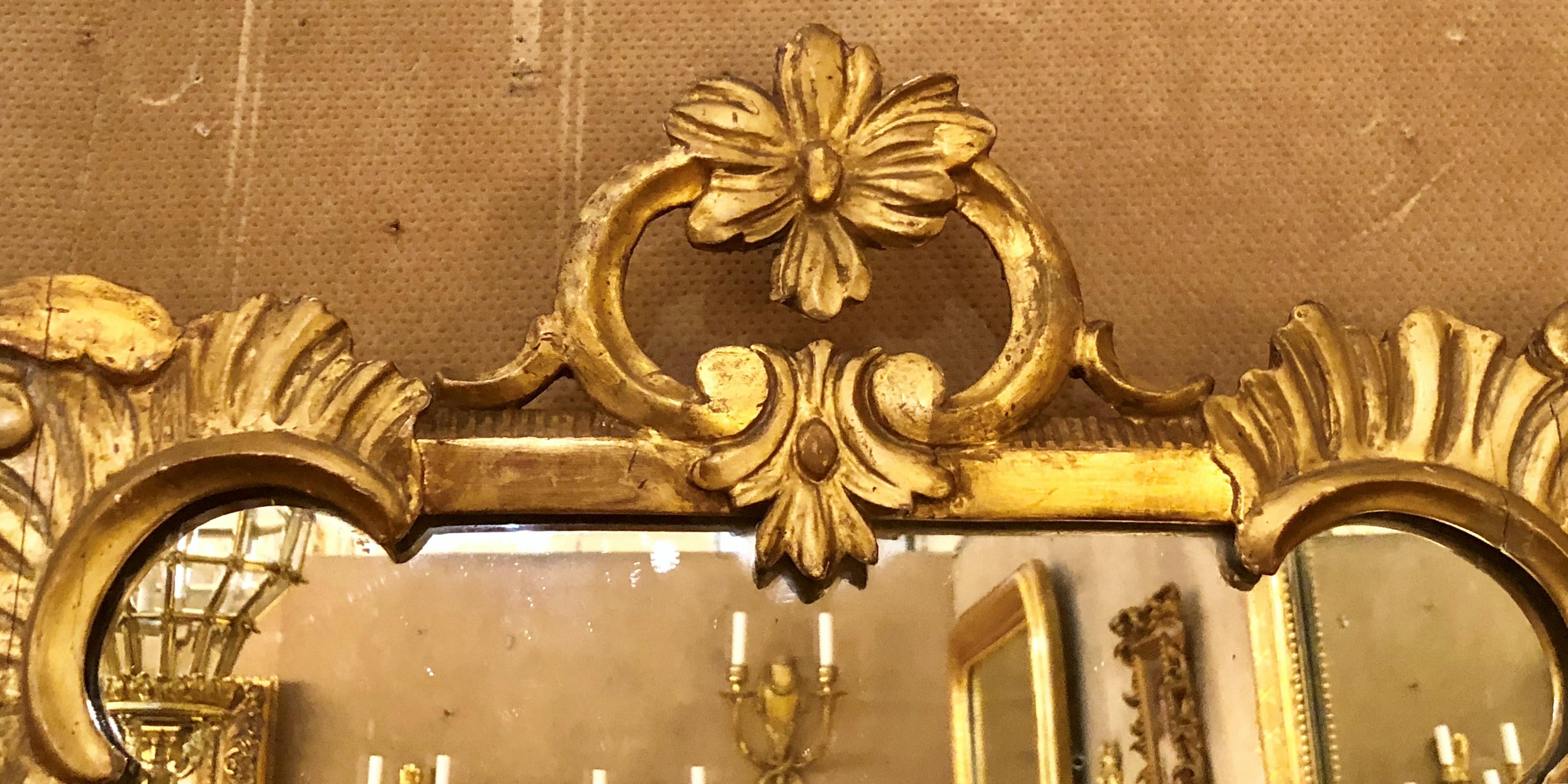 Pair of antique carved wood gilt mirrors.