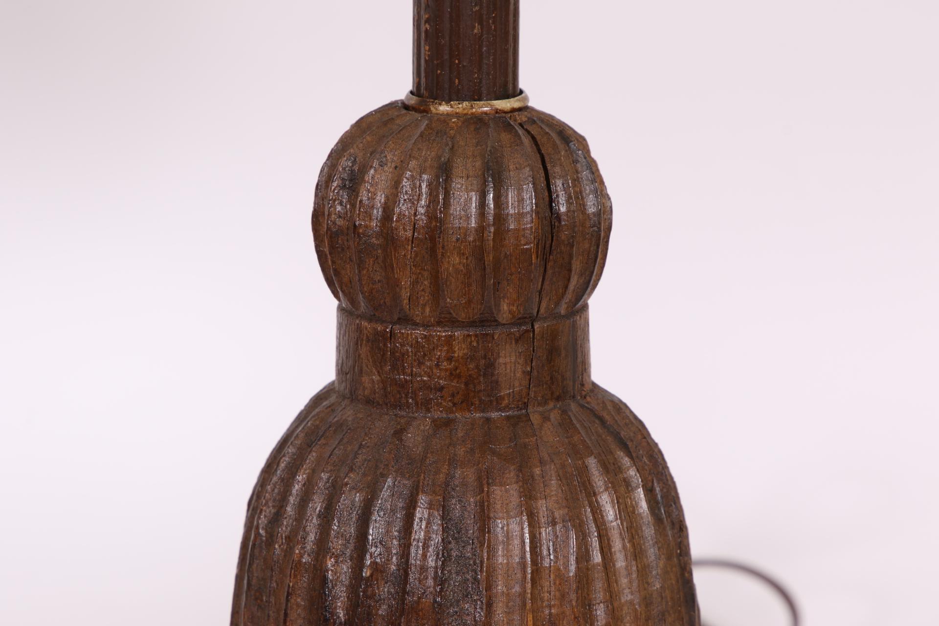 A pair of Antique Wood Tassels, likely some type of Architectural element electrified and  re-created into a pair of diminutive table lamps. The Tassels with ribbed carving and the shades in a Silk type stringing. wood standards. Silk shades.
