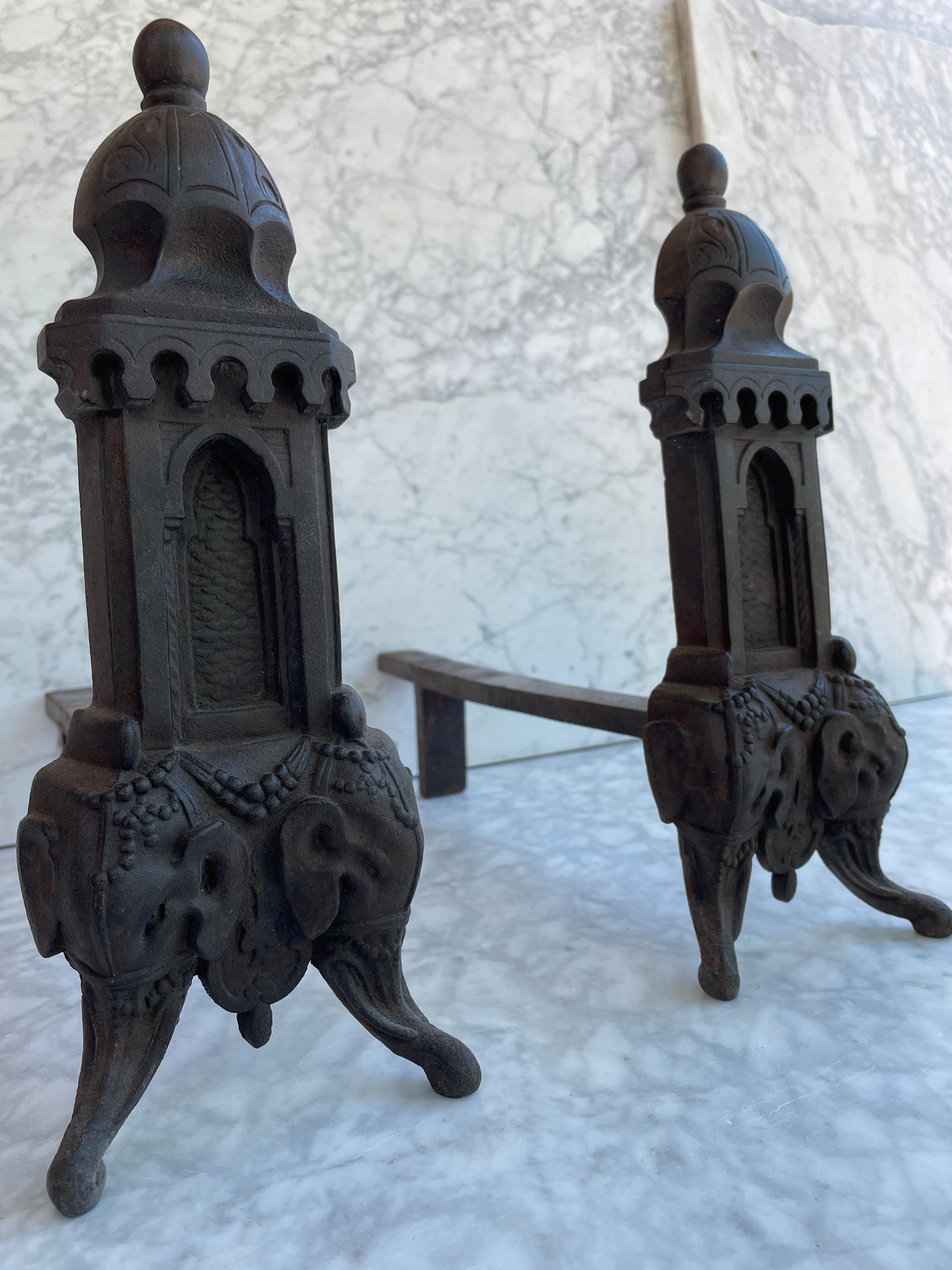 Beautiful detailed antique cast iron andirons.