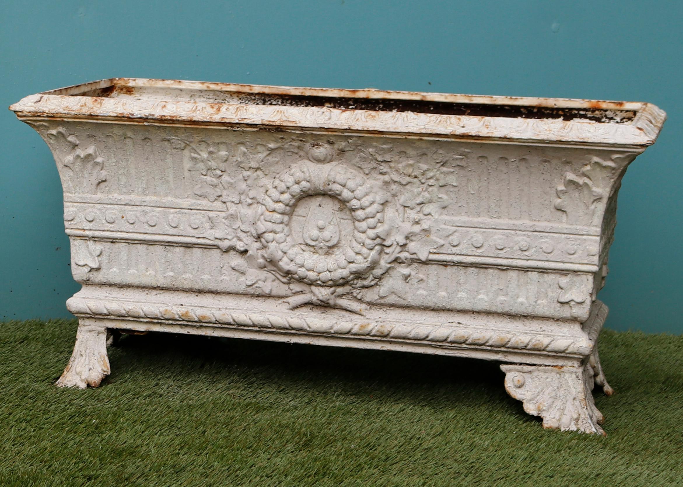 Two cast iron planters of rectangular form, with flared sides and scroll feet, the body ornamented with central cartouche.

Additional Dimensions:

The size quoted below is for each trough.



       