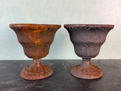 Pair of Antique Cast Iron Garden Urn Planters with Weathered Patina