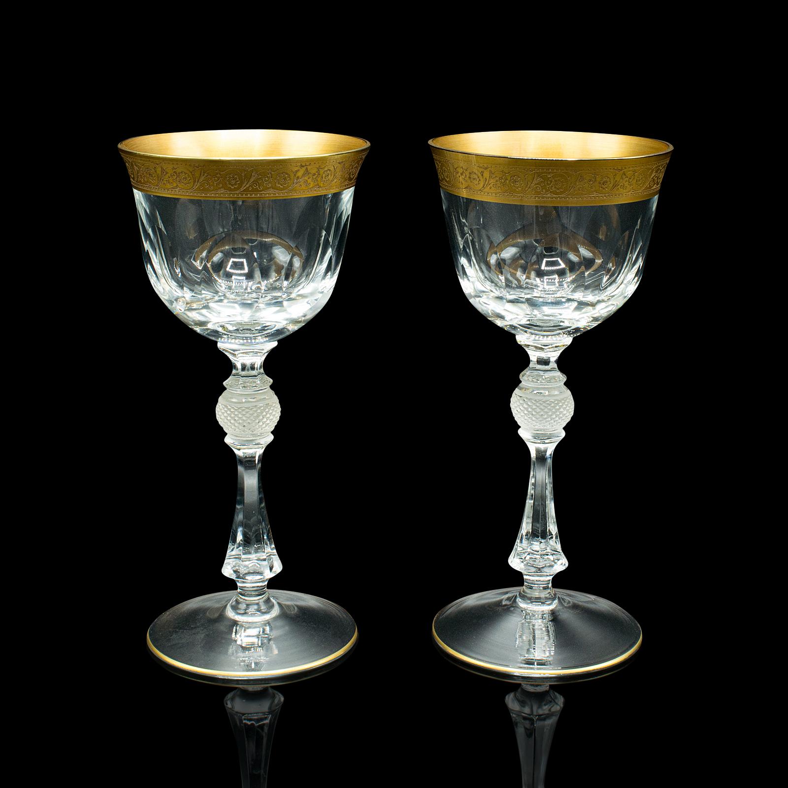 This is a pair of antique celebratory port glasses. A French, gilt decorated stem glass, dating to the Art Deco period, circa 1920.

Dashing port glasses, ideal for special occasions
Displaying a desirable aged patina and in good order
Quality