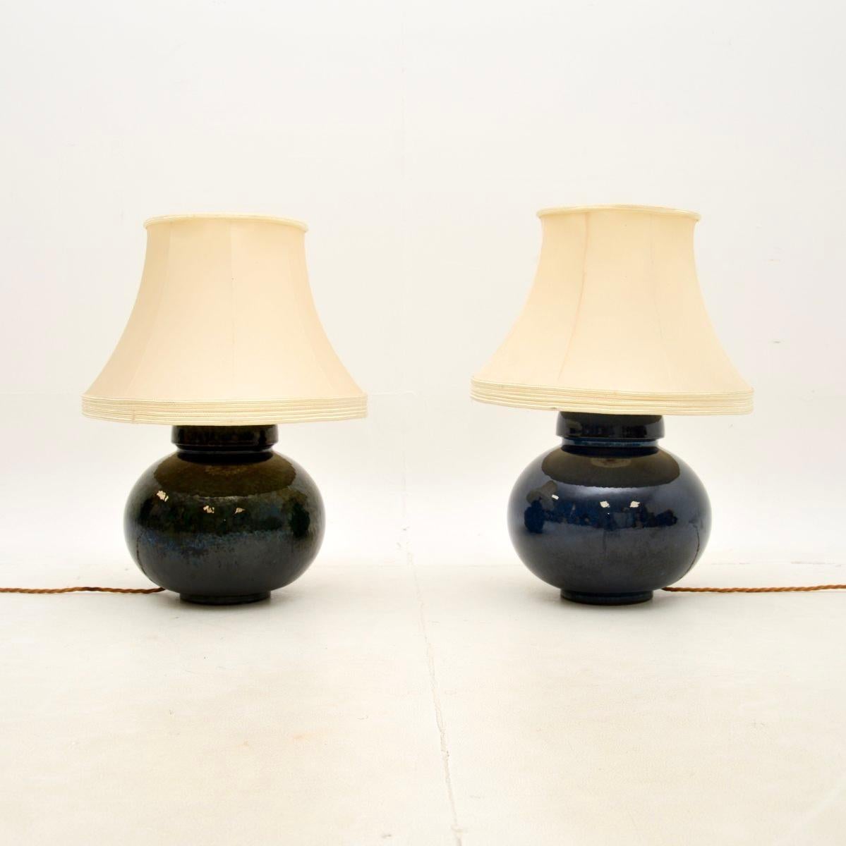 A beautiful pair of antique ceramic table lamps. They were made in England, they date from around the 1930’s.

The design is gorgeous and they are of lovely quality. They are a matched pair, one is blue and one is green, one is also very slightly