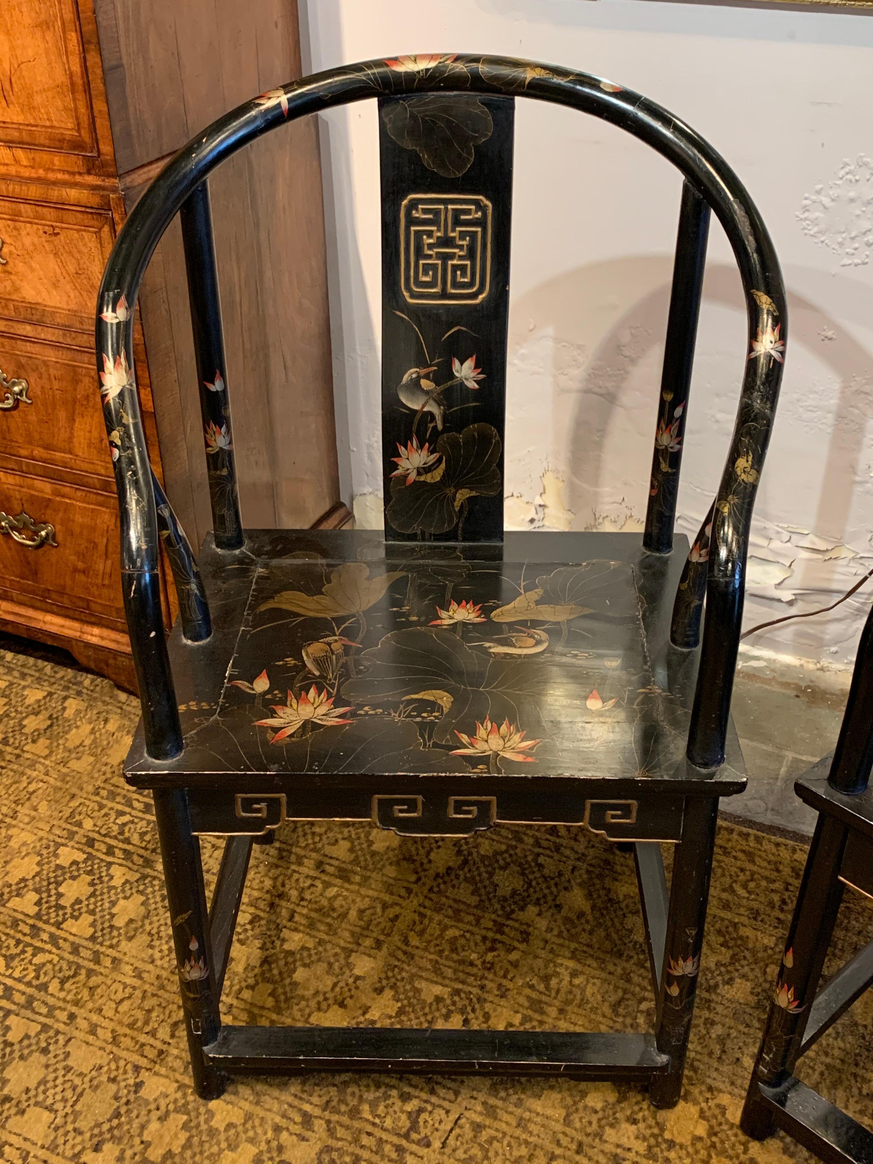 Pair of antique Chinese black lacquer armchairs.