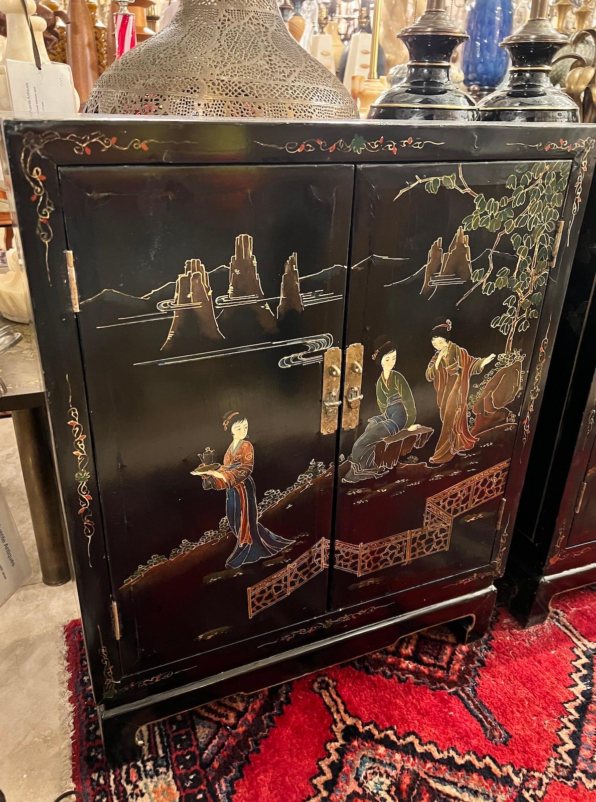 A pair of circa 1920’s Chinese lacquered and painted cabinets.

Measurements:
Height: 30?
Width: 24?
Depth: 12?.