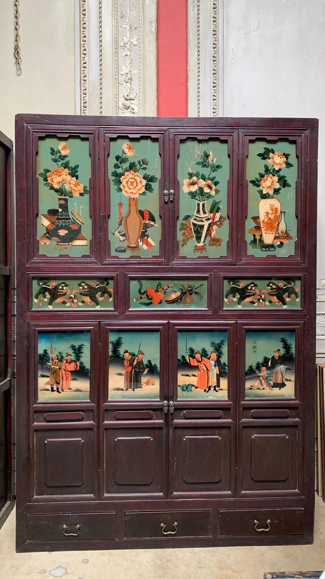 Carved Pair of Antique Chinese Cabinets with Reverse Painted Glass Panels For Sale