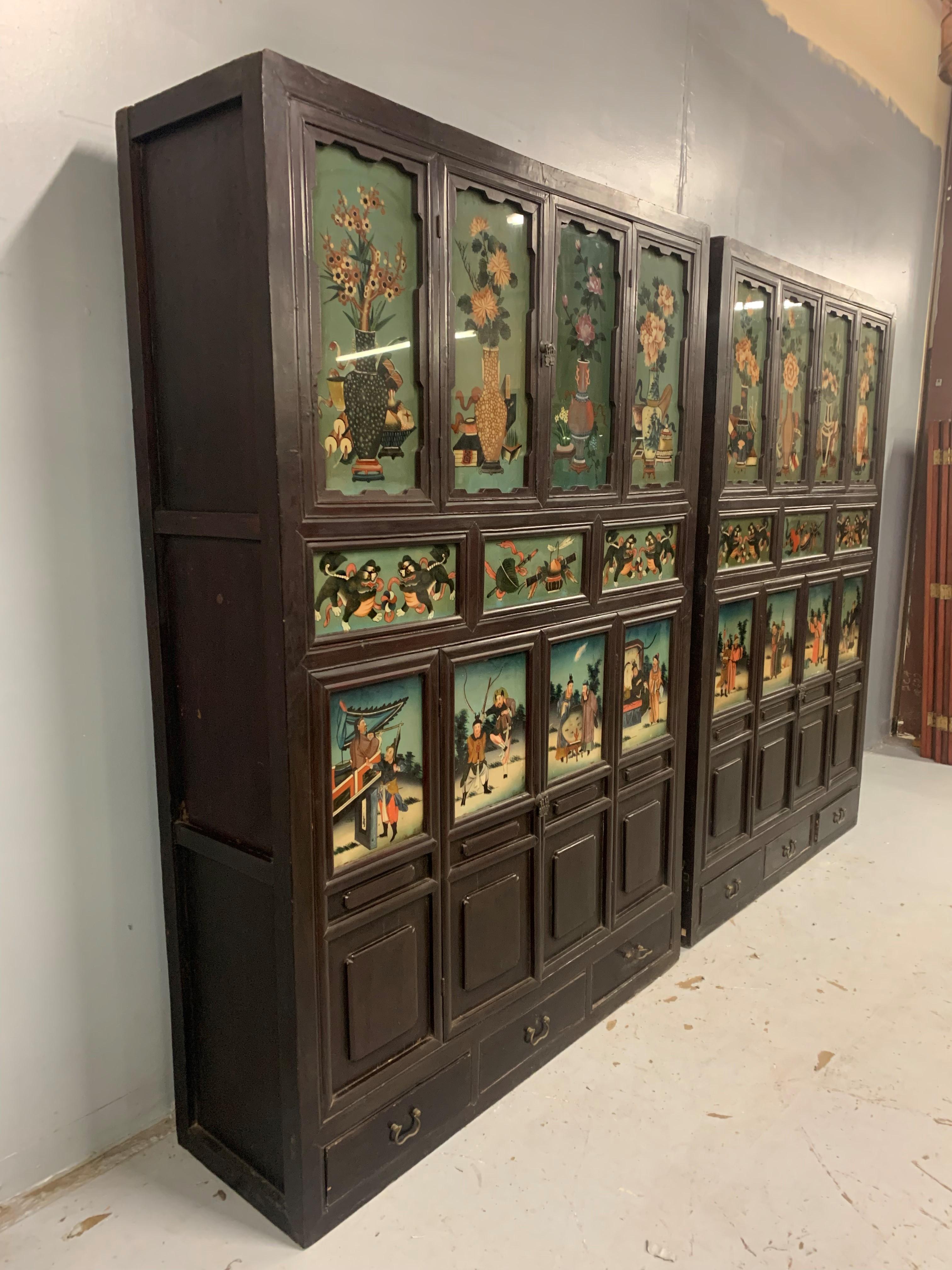 20th Century Pair of Antique Chinese Cabinets with Reverse Painted Glass Panels For Sale