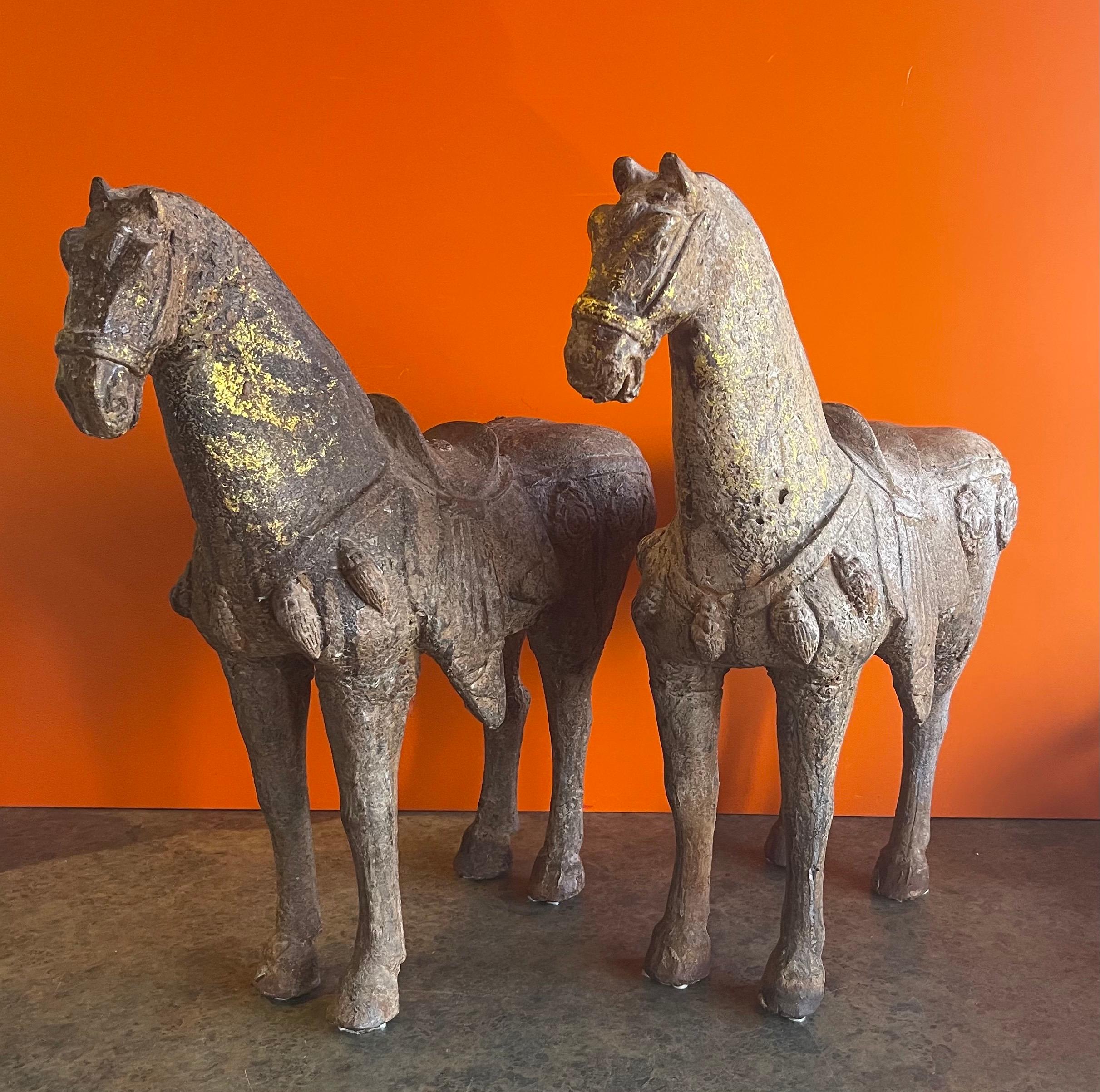 Gorgeous pair of antique Chinese cast iron T’ang horse sculptures, circa 1900. Modeled after an actual horse discovered during the 