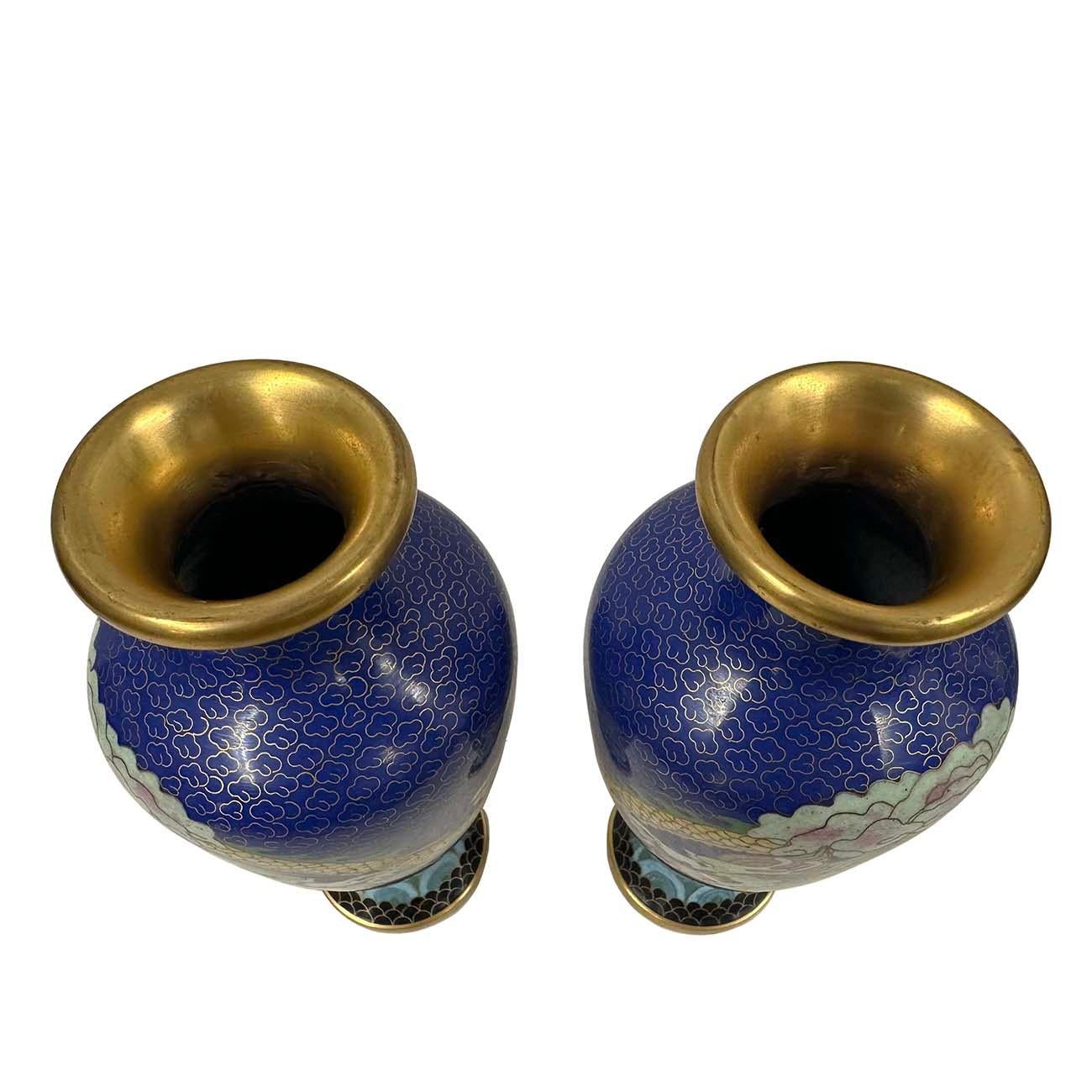 This magnificent pair of Chinese Antique Cloisonné Vases is the perfect decor pieces. With beautiful two dragons playing design, it is a majestically hand crafted work of art that is sure to capture everyone’s attention. Very beautiful. A lot of