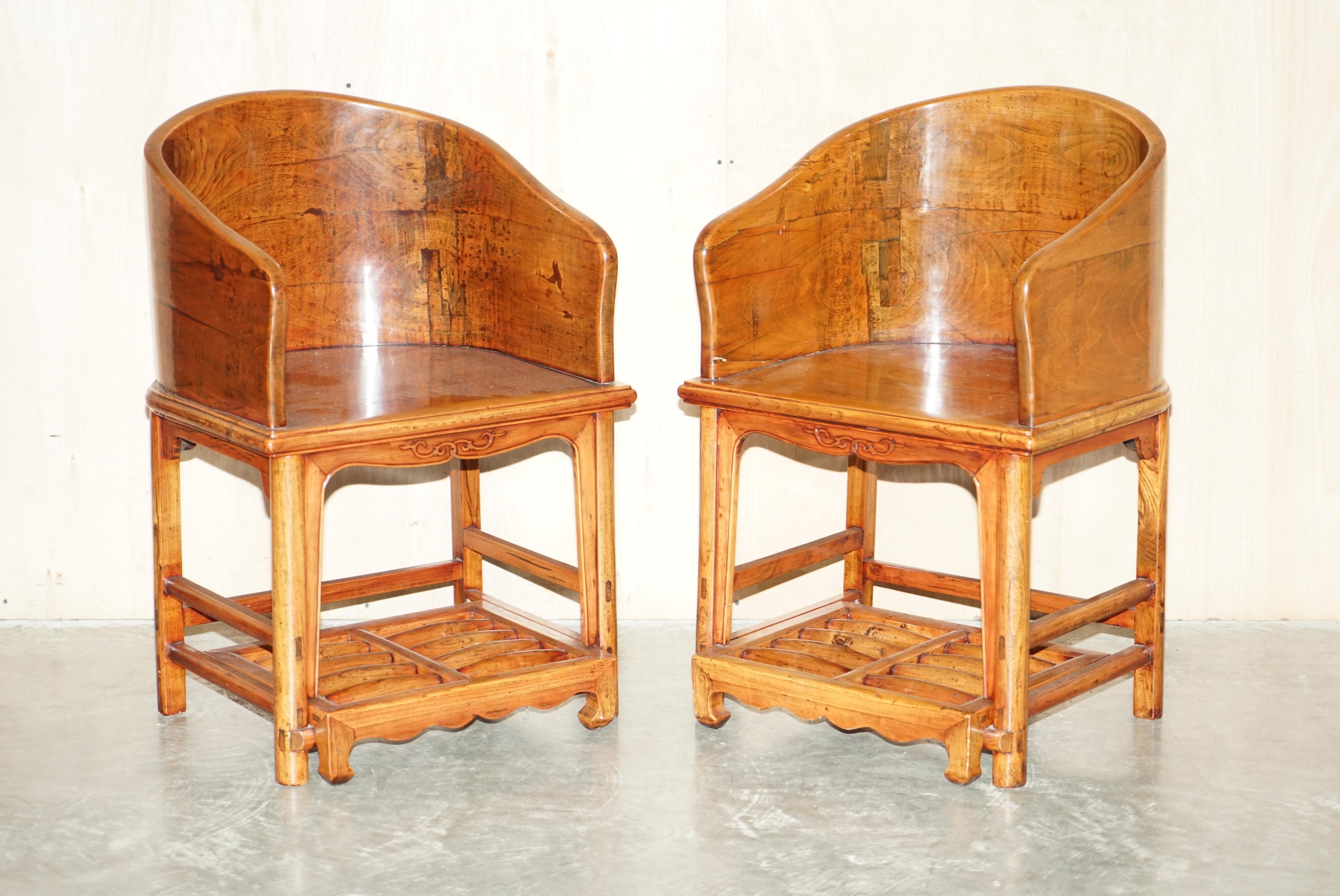 We are delighted to offer for sale this stunning pair of antique Chinese Elm Horseshoe chairs with slide out roller footrests.

A very good looking and decorative pair of antique Chinese Elm armchairs. They each have a slide out footrest which has