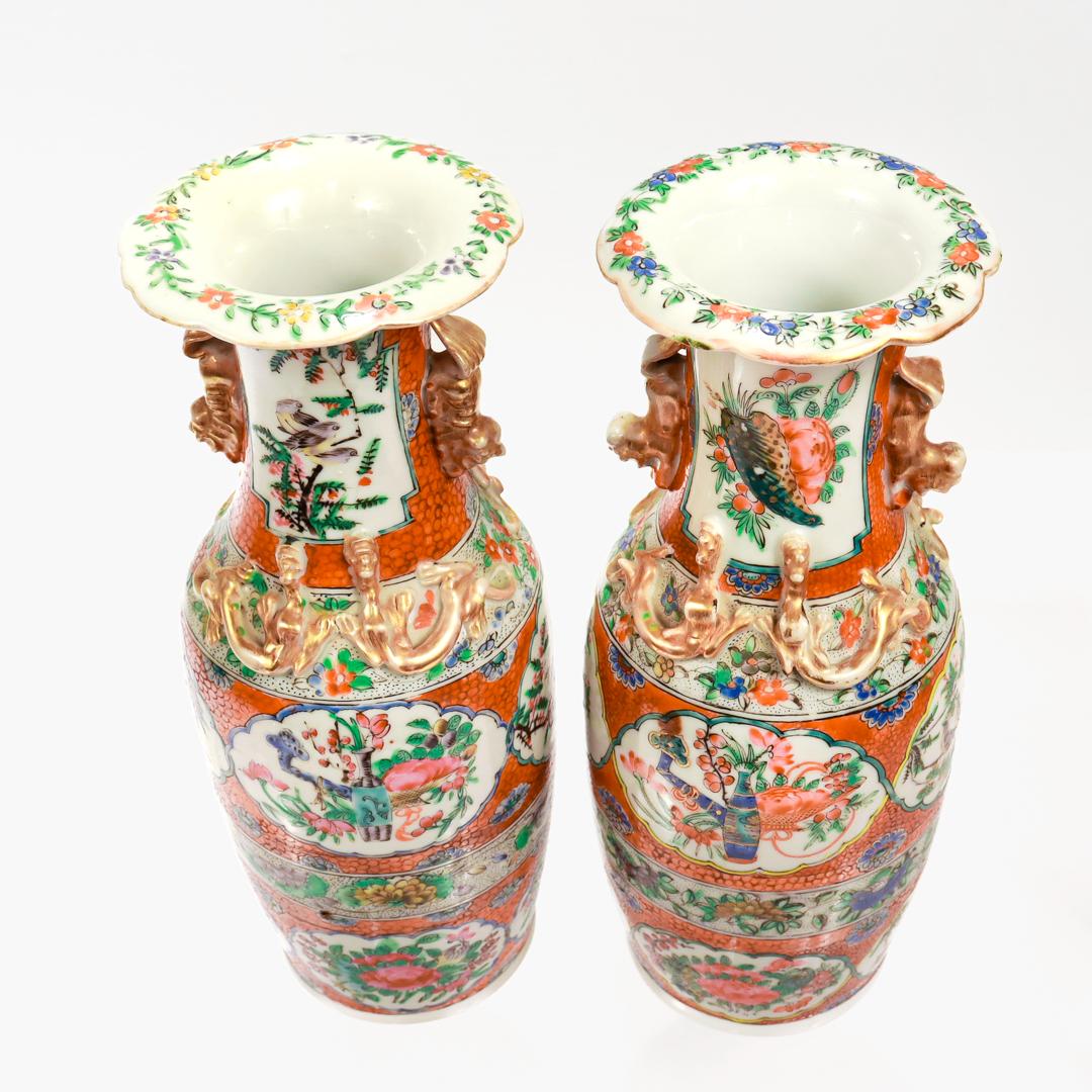 Porcelain Pair of Antique Chinese Export Famille Rose Canton Orange Ground Vases or Urns For Sale