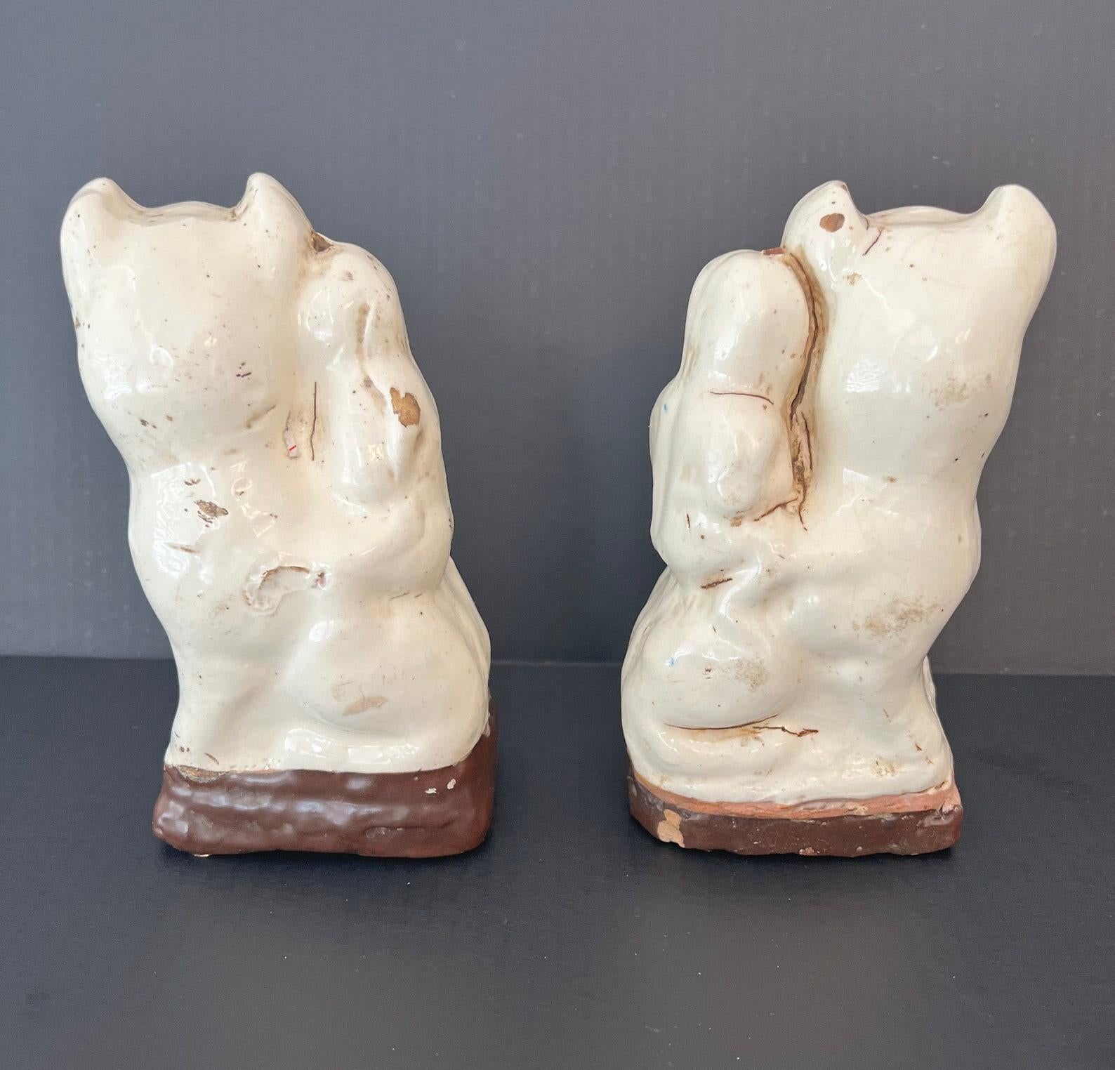 A pair of antique Cizhou-type cream glazed cat (mao) incense stick holders. 

Dating to the early Qing - possibly late Ming Dynasty, scarce near matching mirrored pairs such as this have become exceedingly difficult to find. Born in northern