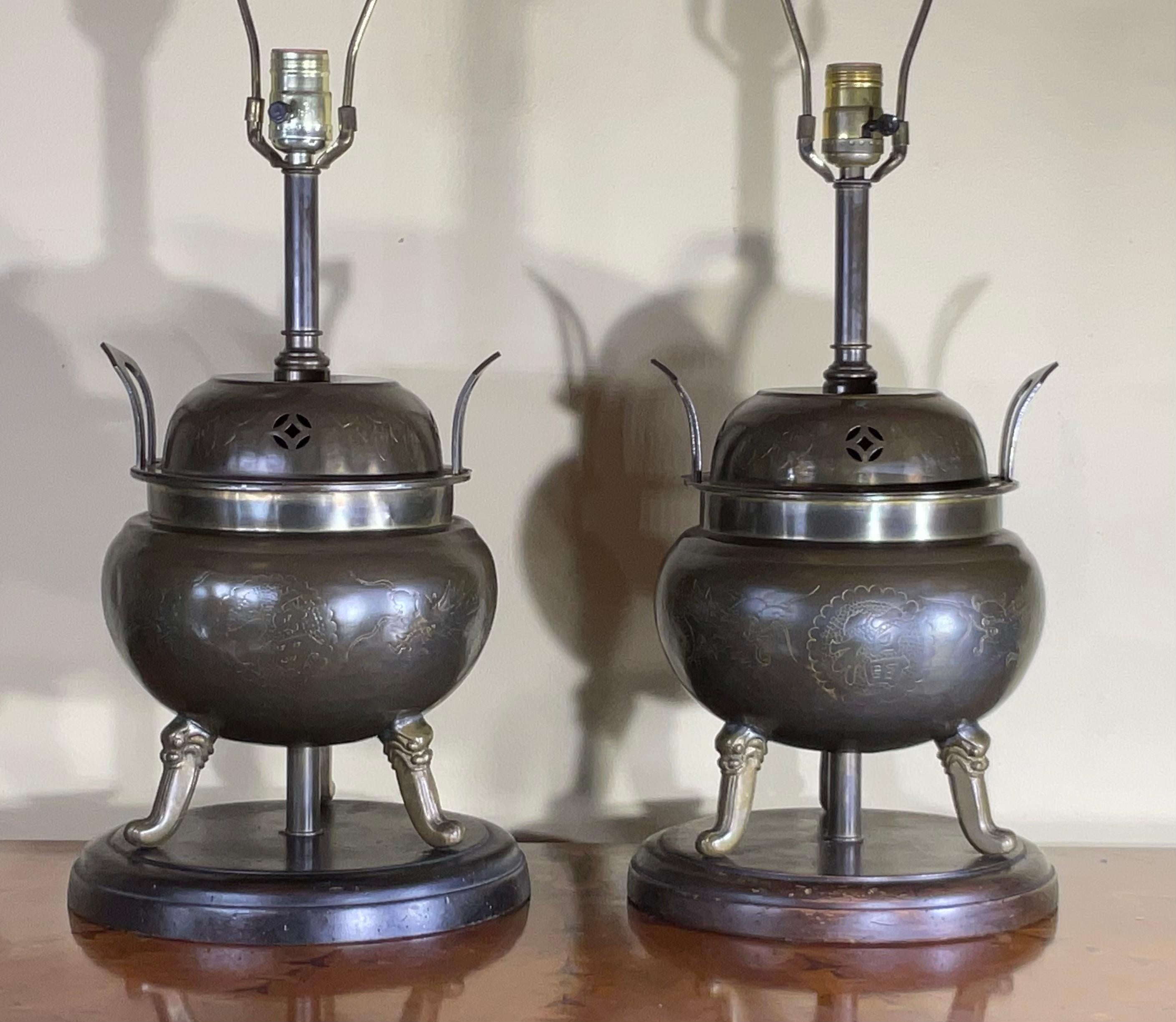 
Pair of elegant  Chinese Antique incense burner. It shows very detailed hand craft works of Chinese calligraphy and dragon etching on copper . With the original food dogs finials .
Shades are not included .
Size of the lamps without lampshade harp