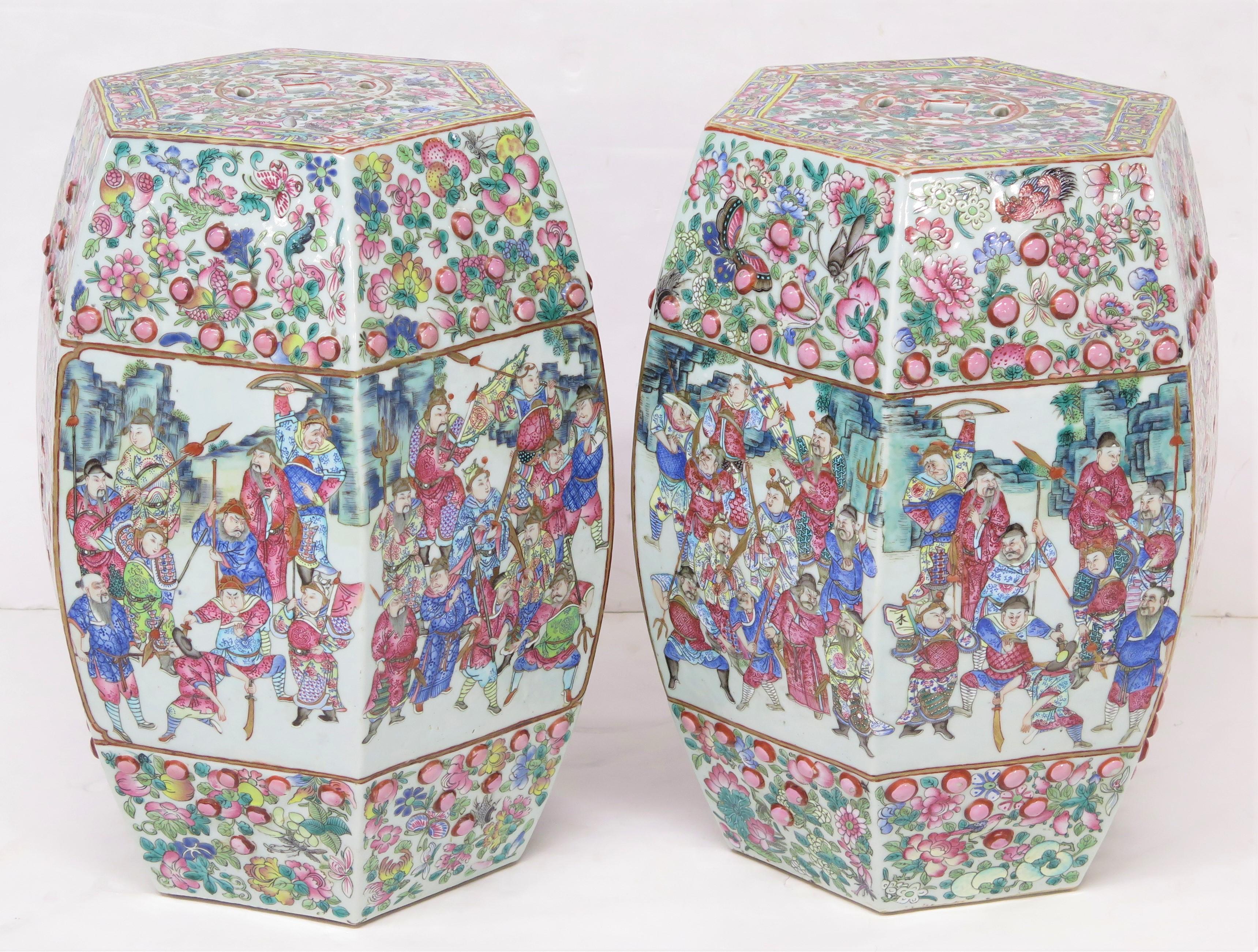 Pair of antique chinese porcelain faceted Barrel shaped garden seats family rose scenes of people note that scenes are a mirror image of each other, circa 1850. China. 