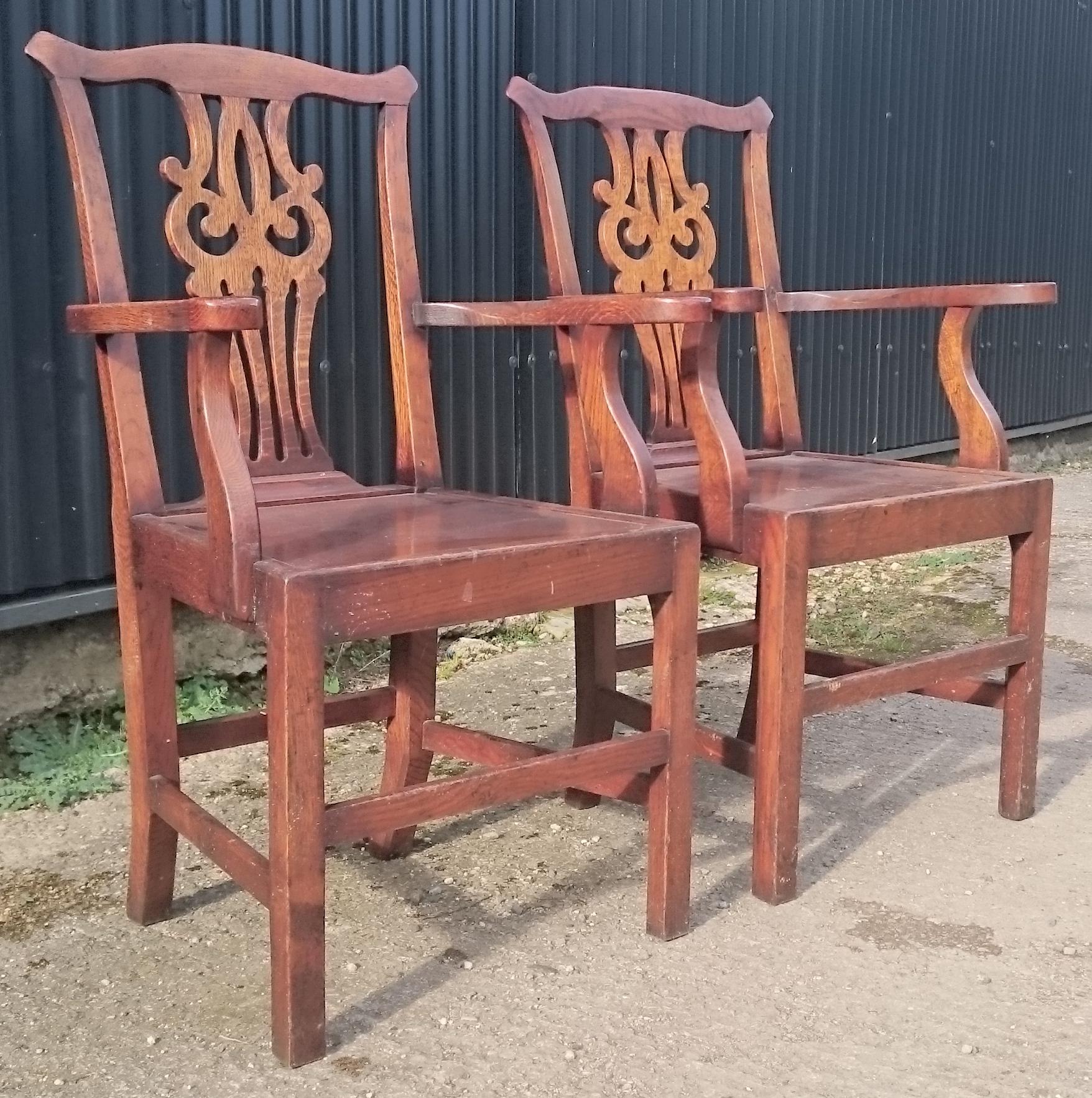 Pair of antique carver armchairs or desk chairs, these are a very charming pair of vernacular Chippendale chairs with pierces back splats, great shape to the arms and H frame stretchers for added strength.

English, circa 1790 

Measures: 62cm /