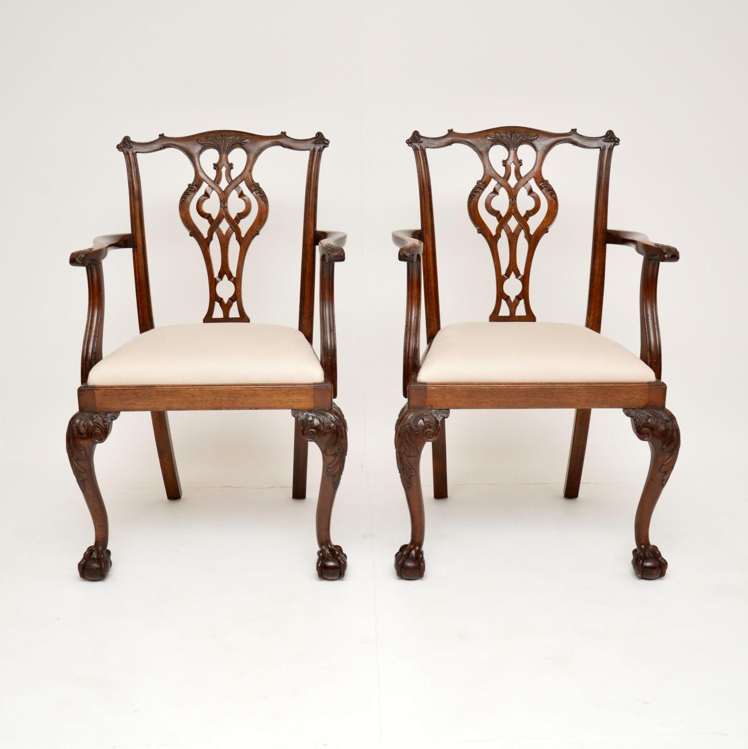 An excellent pair of antique carver chairs in the classic Chippendale style. They were made in England, and date from around the 1890-1910 period.

The quality is superb, they have very well built solid wooden frames. The cabriole legs terminate in