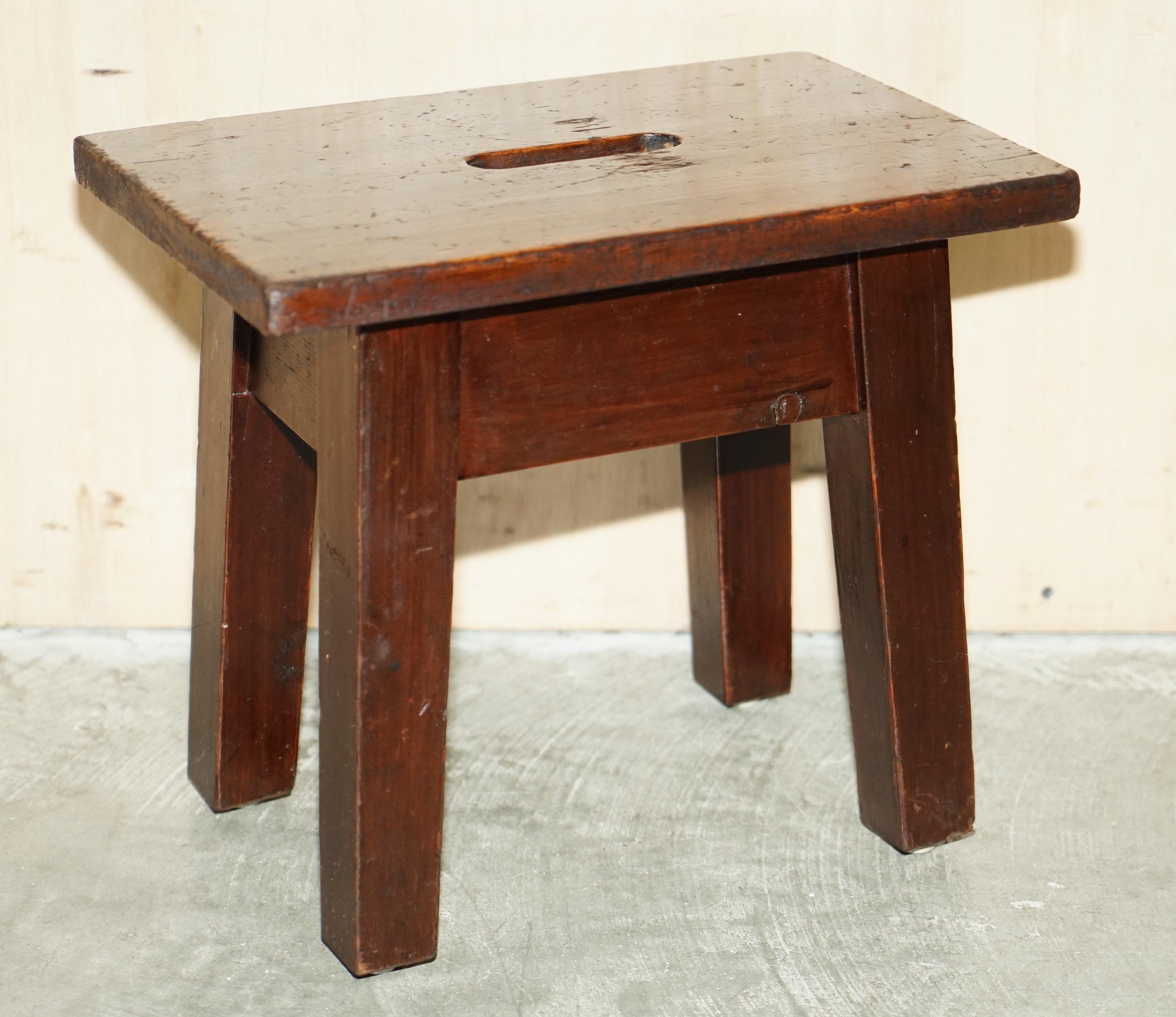 We are delighted to offer for sale this sublime circa 1910 hand made milking stools that work well as little side tables.

A very good looking and well made pair with a wonderful timber patina and worn finish, they designed as milking stools as