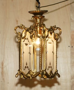 PAIR OF ANTIQUE CiRCA 1920 POLISHED BRASS HANGING LANTERNS WITH FROSTED GLASS