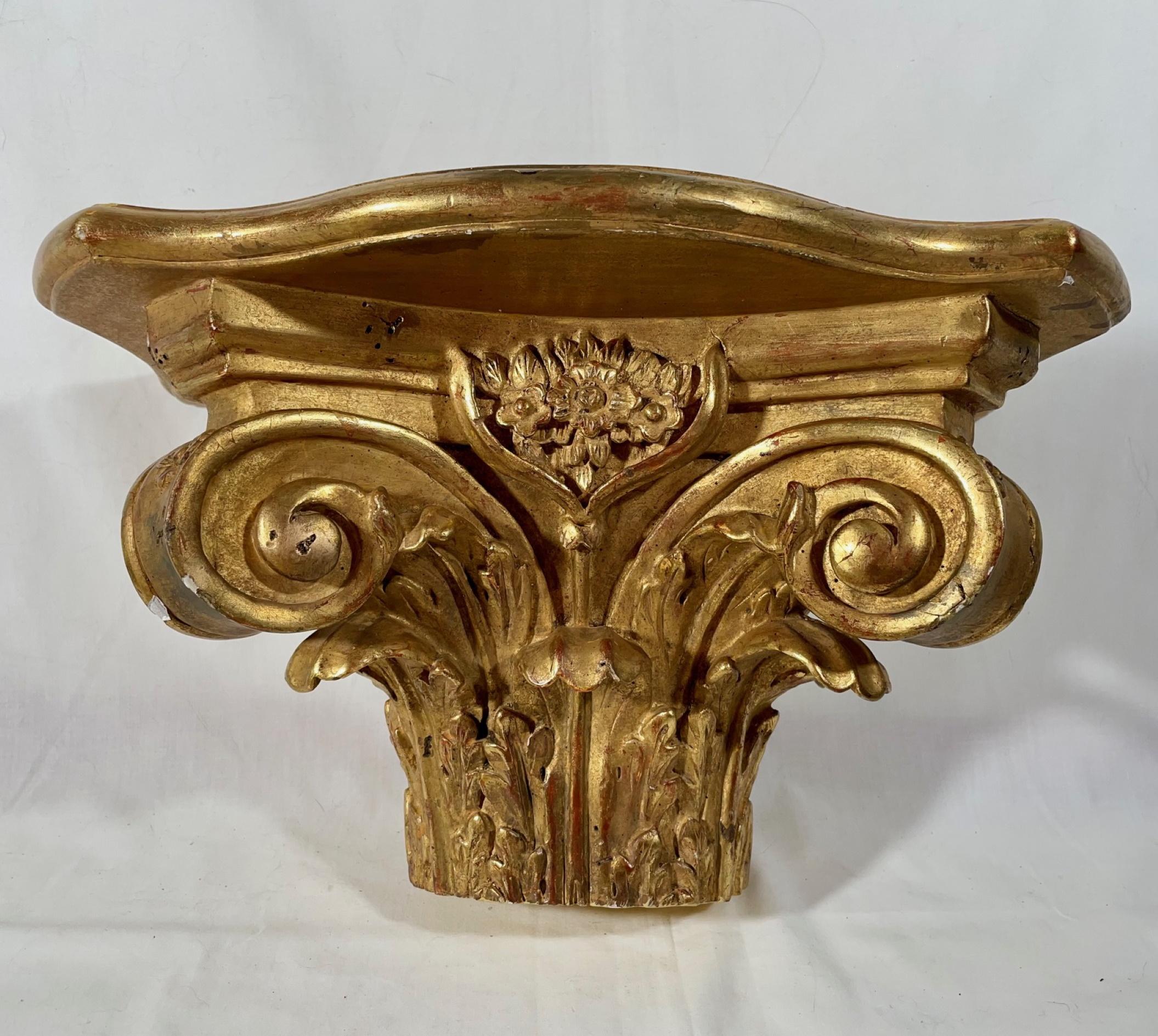 Pair of antique Corinthian half capital gilded wood wall brackets

Superb and elegant pair of half Corinthian capitals. Carved wood in deep relief, decorated with long acanthus leaves and deep volute scrolls. Highly burnished water gilding and the