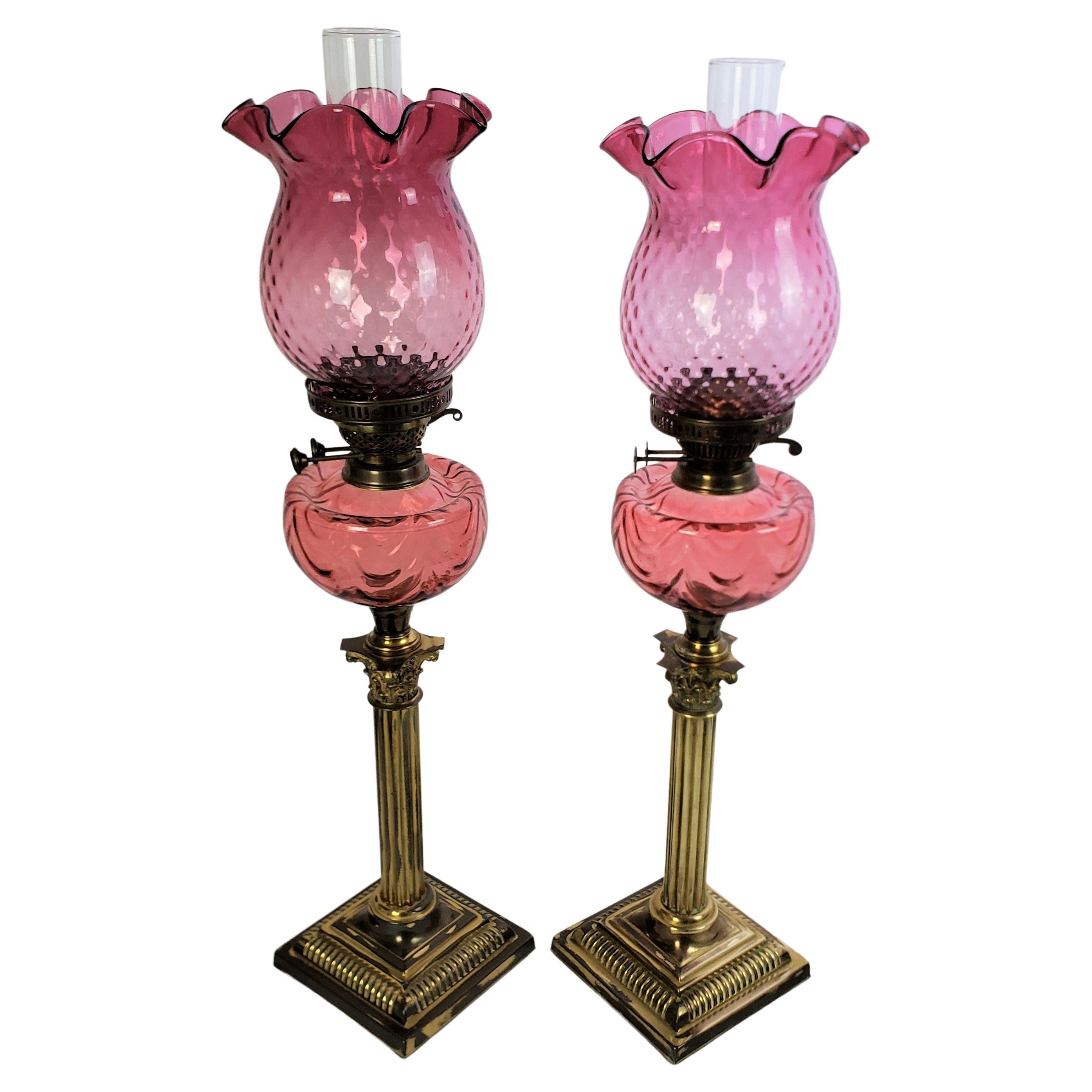 Pair of Antique Cranberry & Brass Corinthian Column Banquet or Parlor Oil Lamps