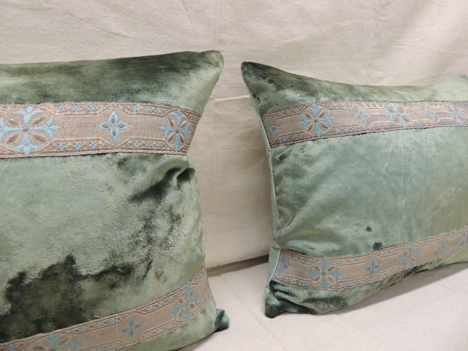 Pair of antique crushed velvet green and silver bolsters decorative pillows
with 19th century metallic trims and aqua color silk backings.
Decorative pillow handcrafted and designed in the USA.
Closure by stitch (no zipper closure) with