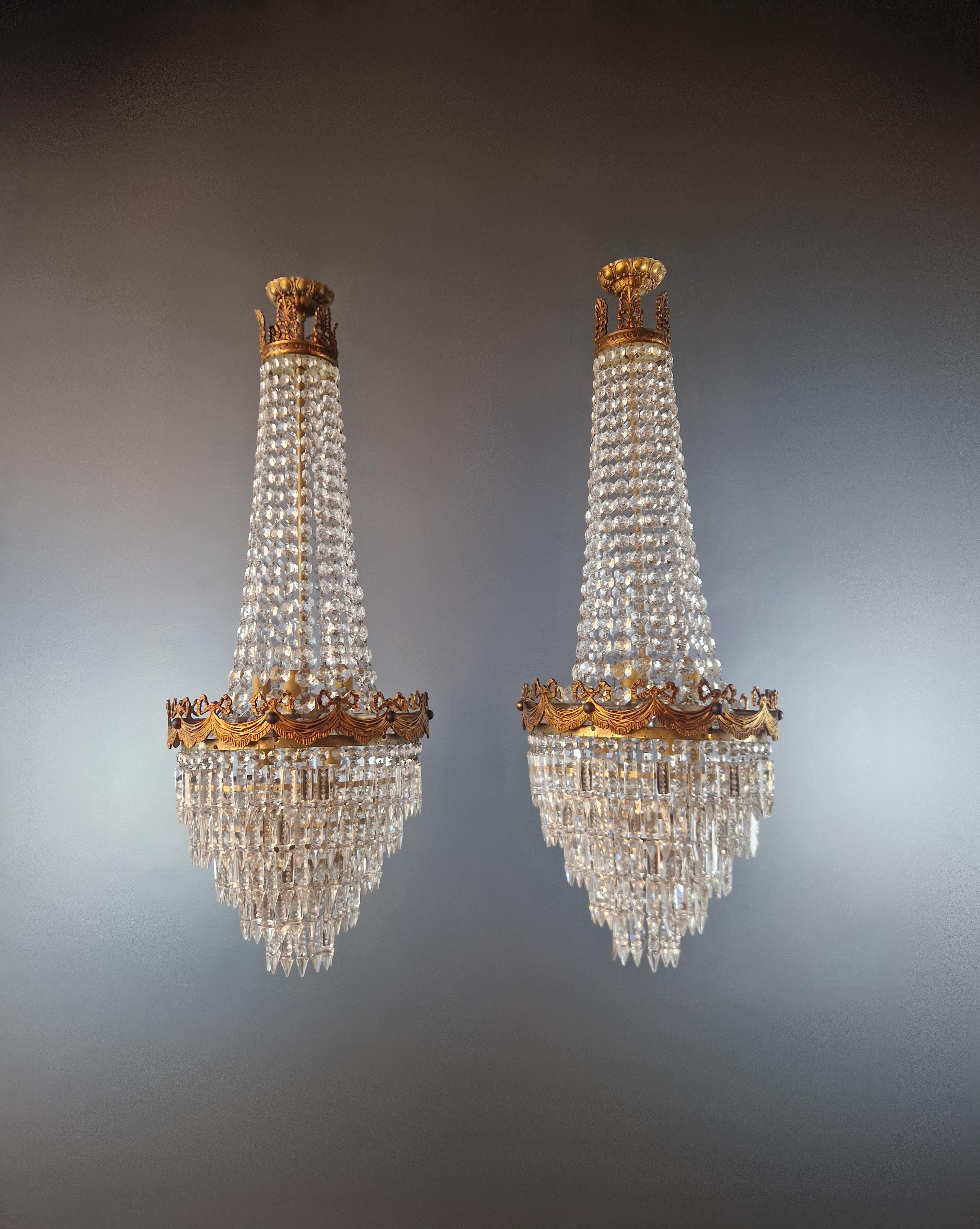 Immerse yourself in the magic of yesterday with these exquisite hand-linked crystal chandeliers, a blend of elegance and Art Nouveau opulence. Carefully restored in Berlin, these chandeliers harmoniously combine vintage charm with modern