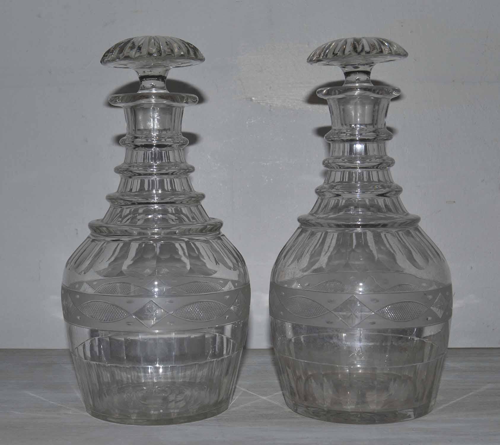 Fine pair of cut crystal decanters in Georgian style

English, 19th century.

With pontil marks.

Original stoppers.

There are a couple of minor nibbles to both stoppers. I would say normal wear and tear for the age of the decanters.
   