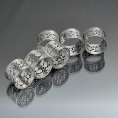 Set of six numbered silver napkin rings